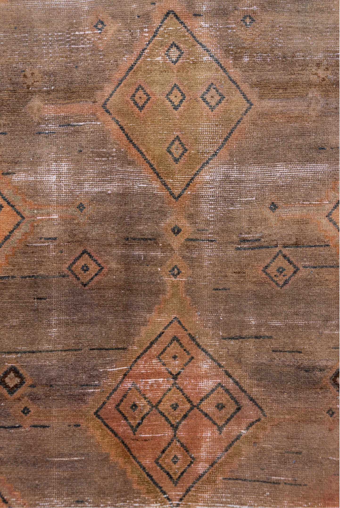 4' x 9' one-of-a-kind handmade vintage Distressed runner rug. Color palette: black, brown, charcoal, gray, light gray