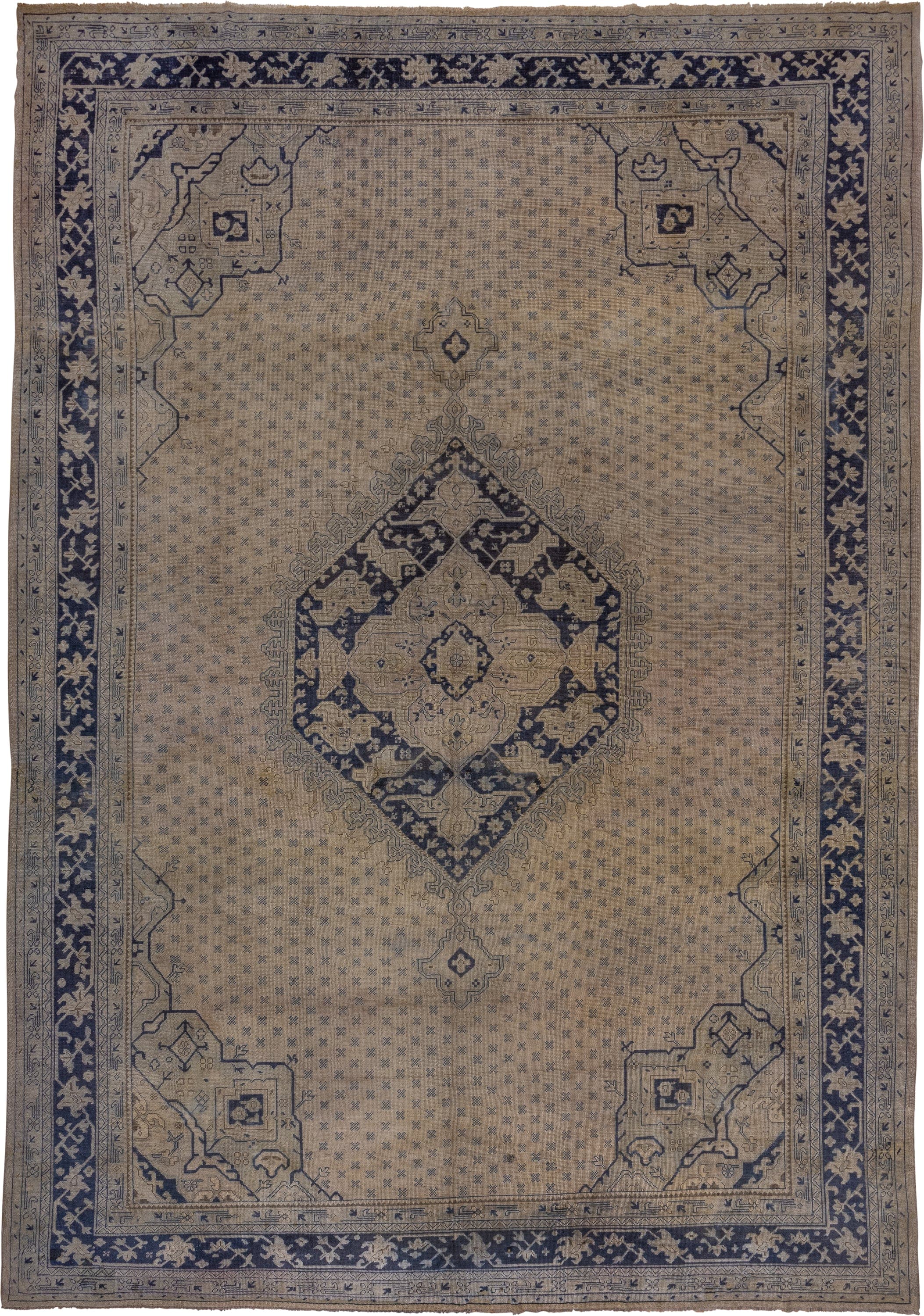 13' x 18' one-of-a-kind handmade antique Oushak oversize rug. Color palette: ivory, indigo, taupe, slate, beige, purple