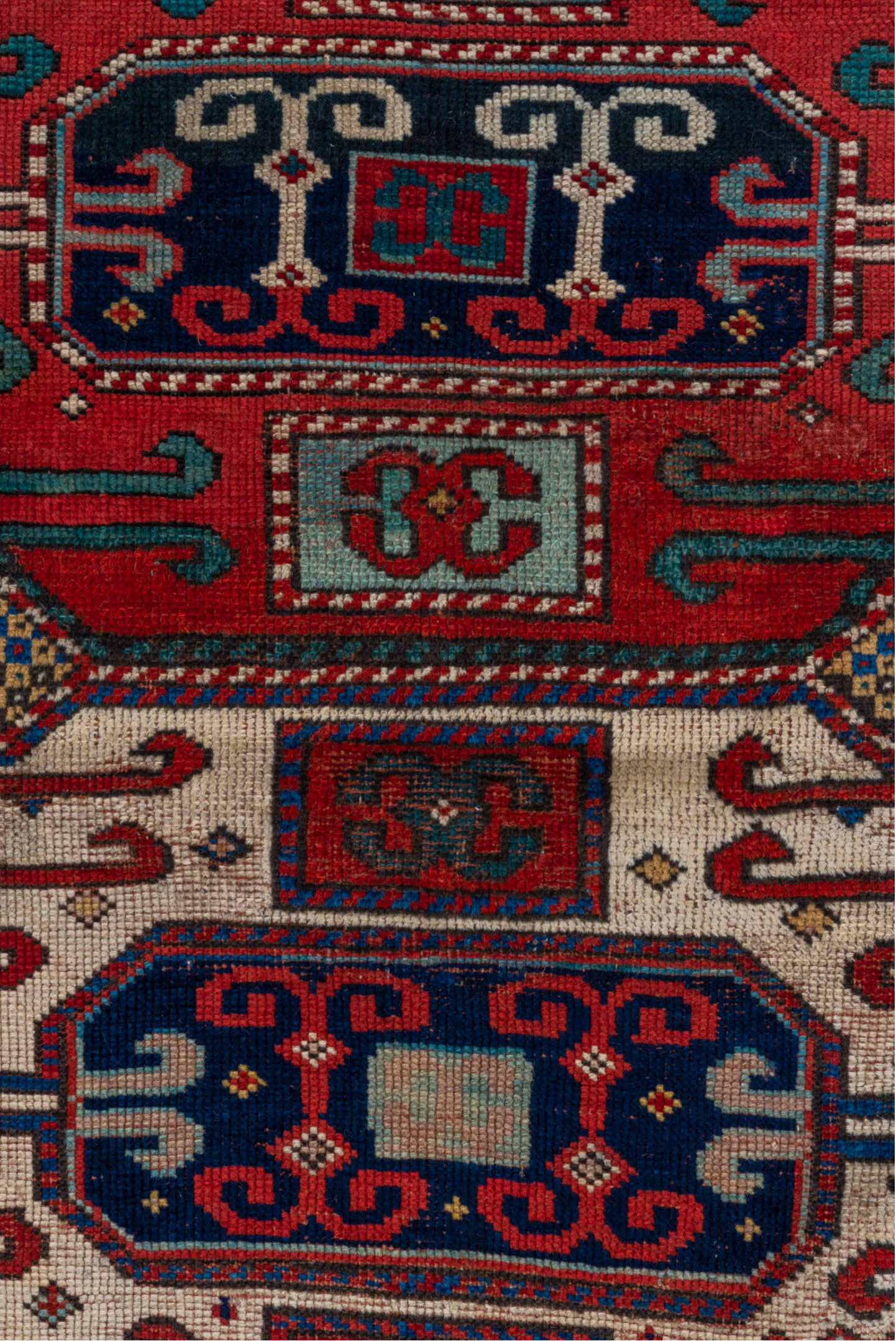 4' x 4' one-of-a-kind handmade antique Kazak small size rug. Color palette: ivory, red, navy, cobalt, teal, crimson, camel