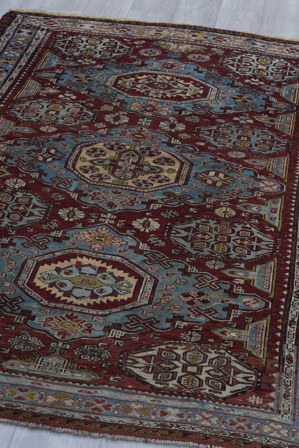 4' x 6' one-of-a-kind handmade antique Sumak rug. Color palette: rust, powder blue, ivory, charcoal, burgundy, camel, slate