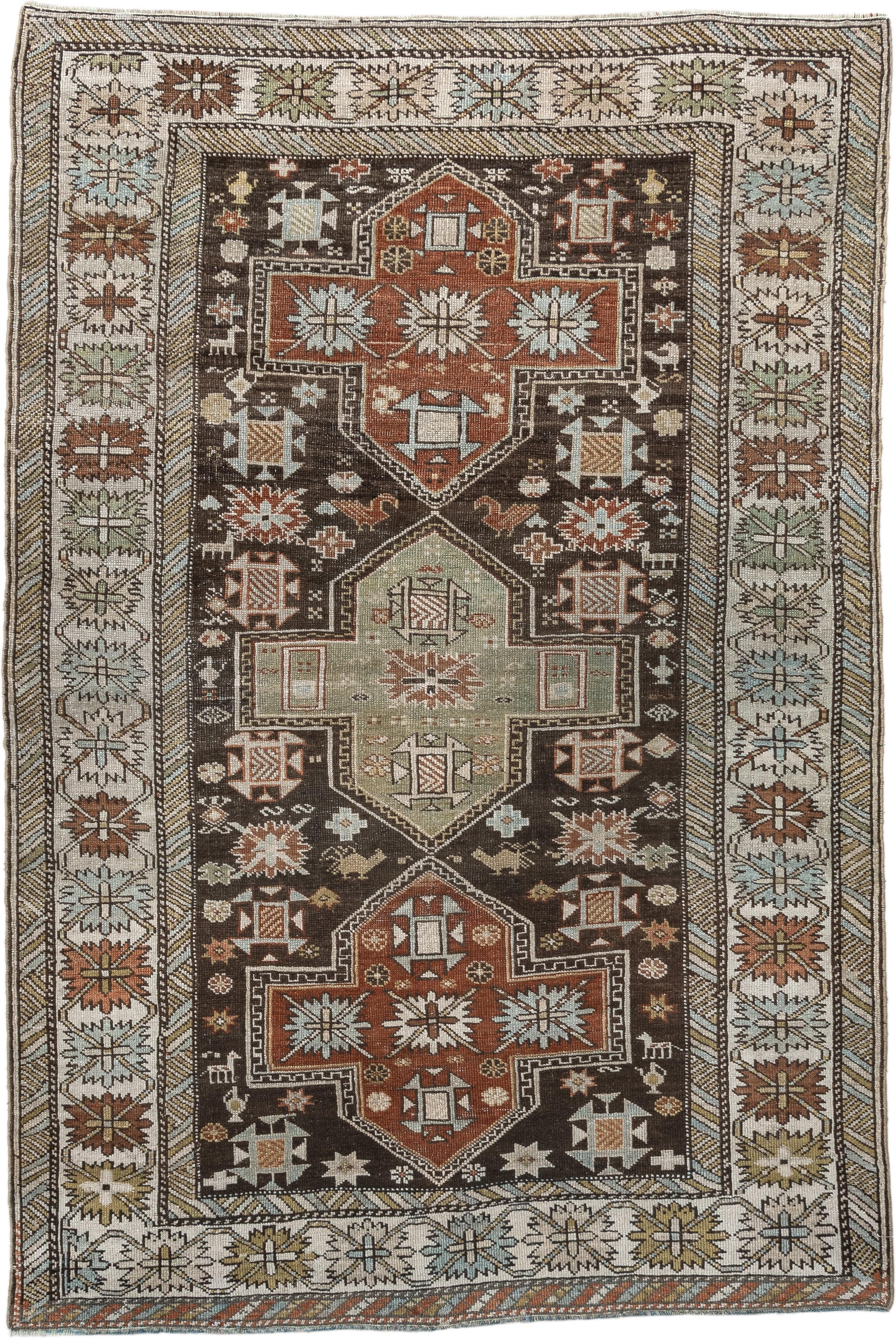 3' x 5' one-of-a-kind handmade antique Shirvan small size rug. Color palette: ivory, dark brown, rust, pale sage, sky blue