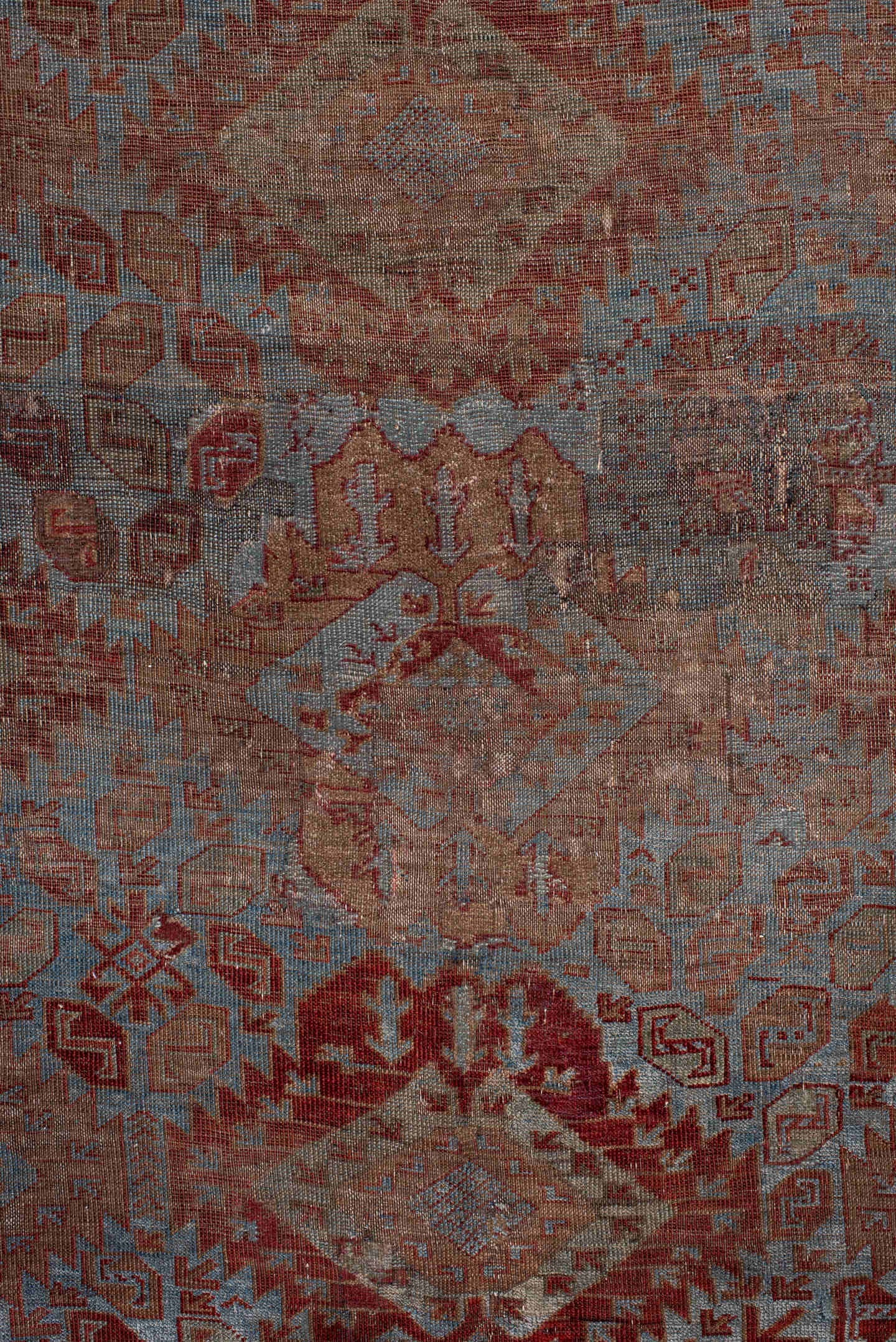 6' x 9' one-of-a-kind handmade antique Belouch rug. Color palette: rust, dusty blue, ivory, taupe, burgundy, brown