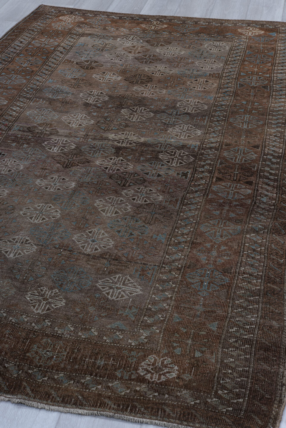 5' x 8' one-of-a-kind handmade vintage Belouch medium size rug. Color palette: brown, taupe, ivory, charcoal, slate, camel