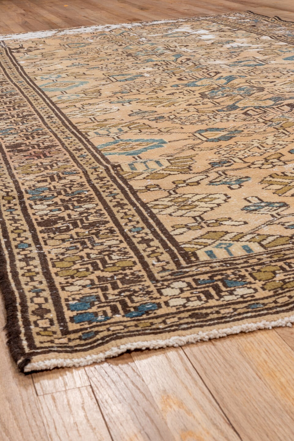5' x 9' one-of-a-kind handmade vintage Distressed medium size rug. Color palette: tan, ivory, brown, muted blue, taupe