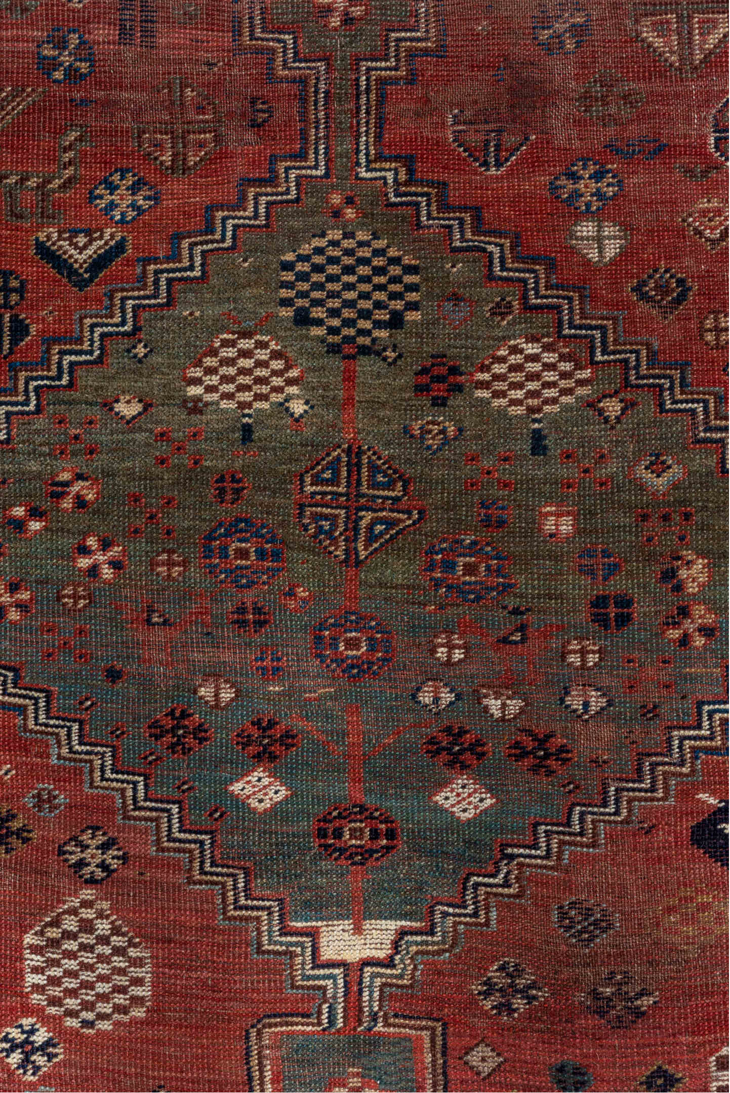 5' x 8' one-of-a-kind handmade antique Qashqai medium size rug. Color palette: rust, indigo, ivory, slate, terra cotta