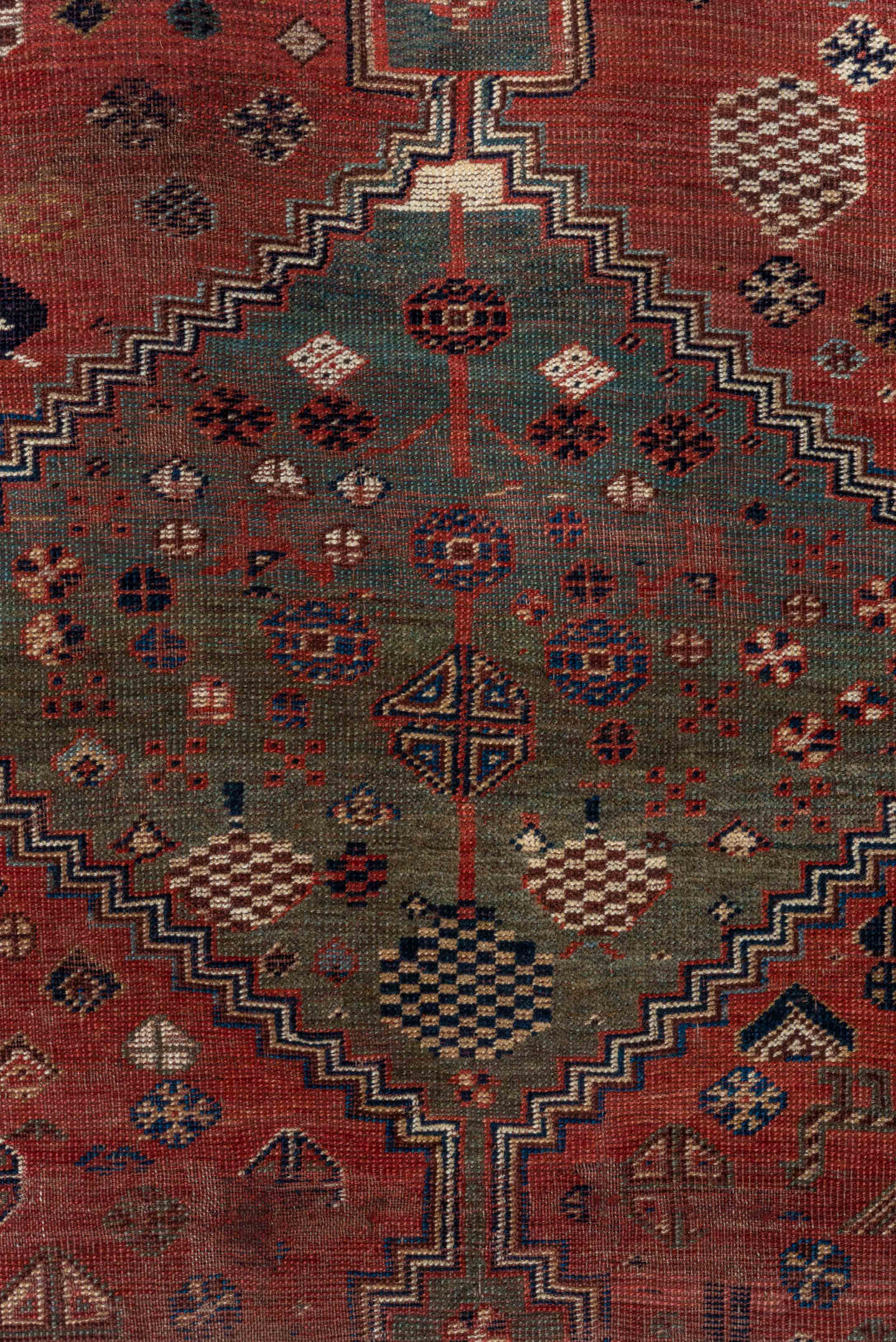 5' x 8' one-of-a-kind handmade antique Qashqai medium size rug. Color palette: rust, indigo, ivory, slate, terra cotta