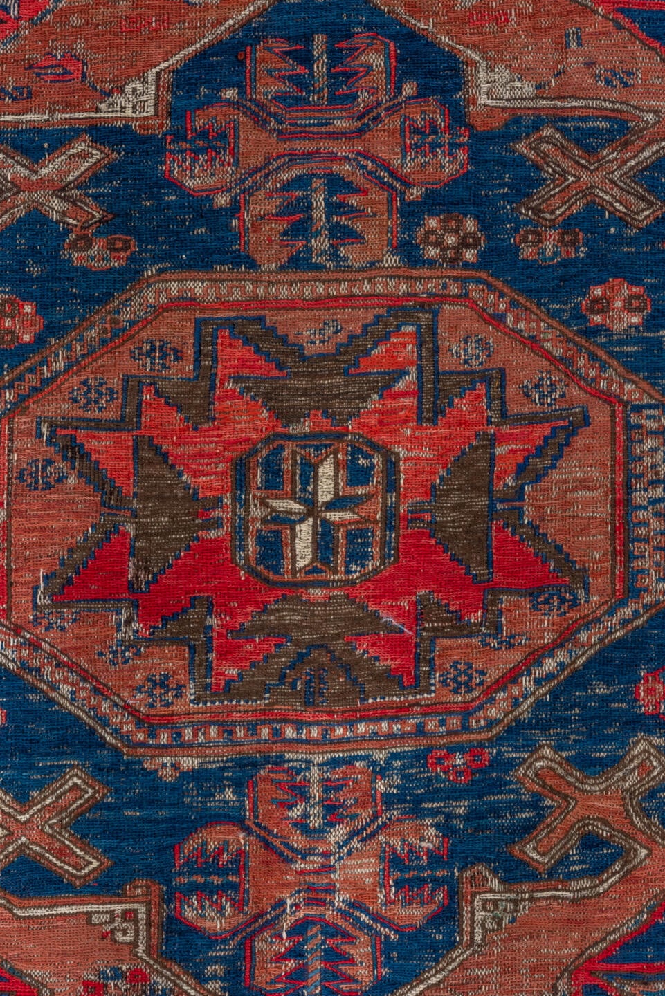 6' x 9' one-of-a-kind handmade antique Sumak medium size rug. Color palette: terra cotta, indigo, sky blue, rust, crimson