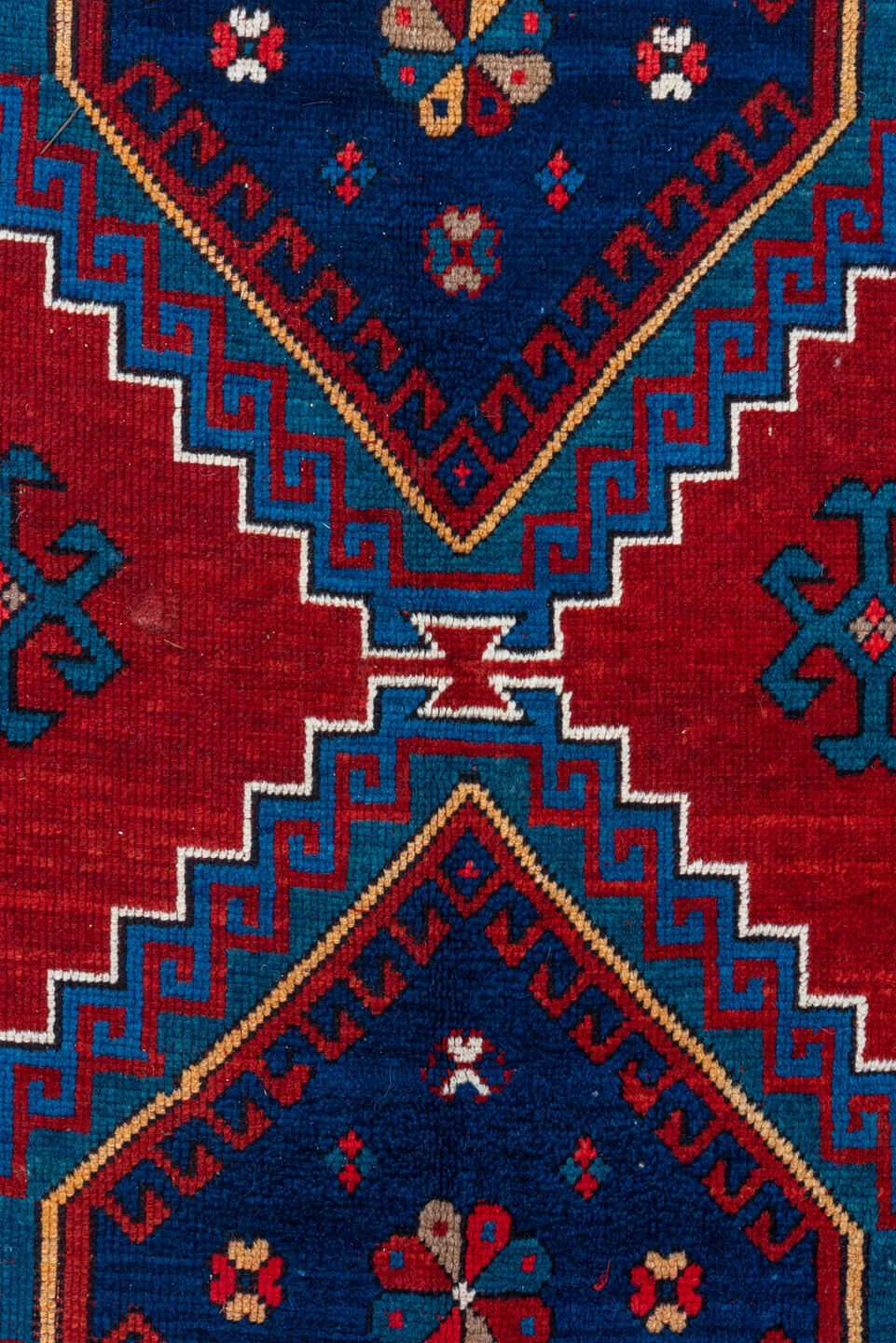 4' x 10' one-of-a-kind handmade antique Kazak runner rug. Color palette: red, navy, sky blue, ivory, crimson, charcoal, rose