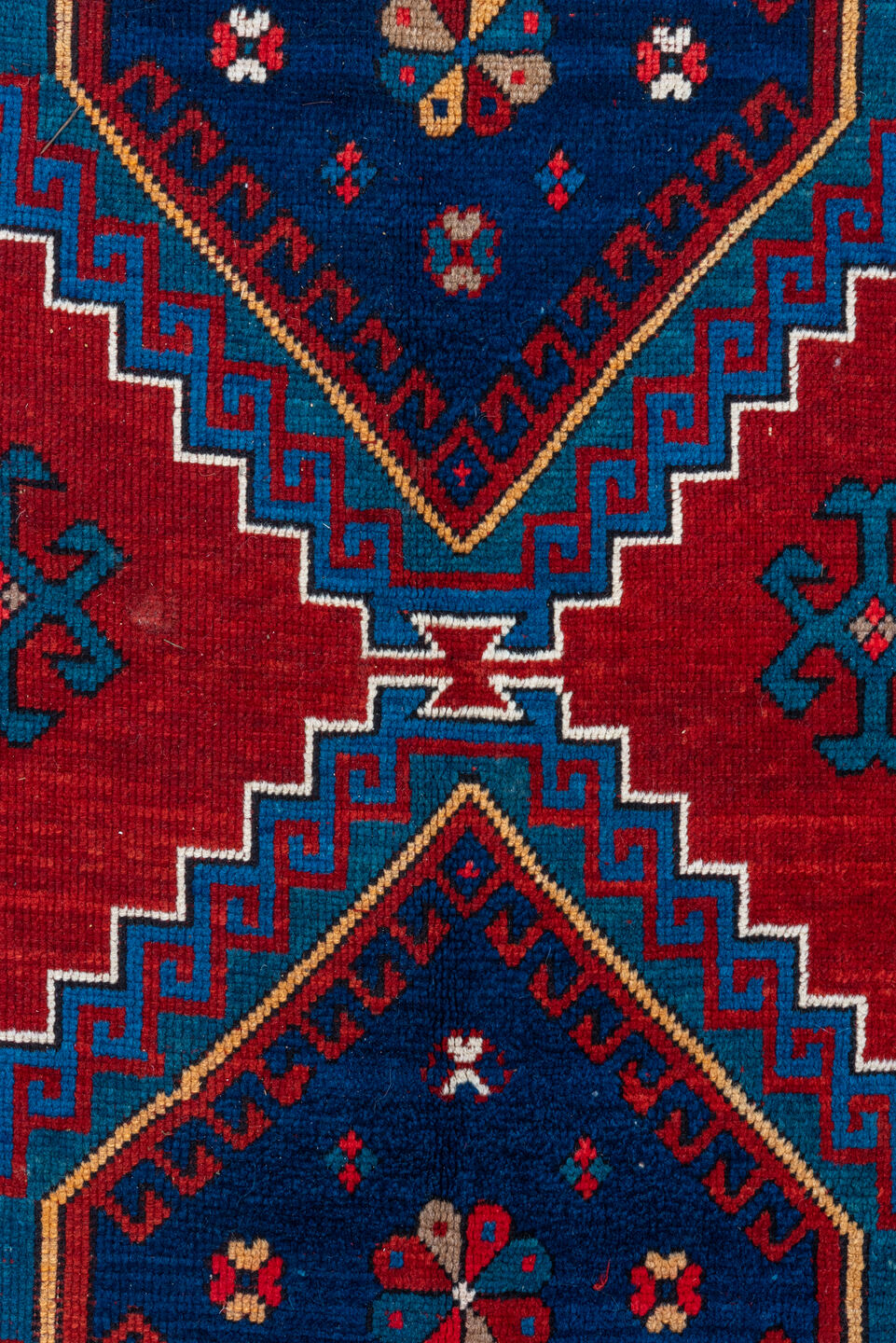 4' x 10' one-of-a-kind handmade antique Kazak runner rug. Color palette: red, navy, sky blue, ivory, crimson, charcoal, rose