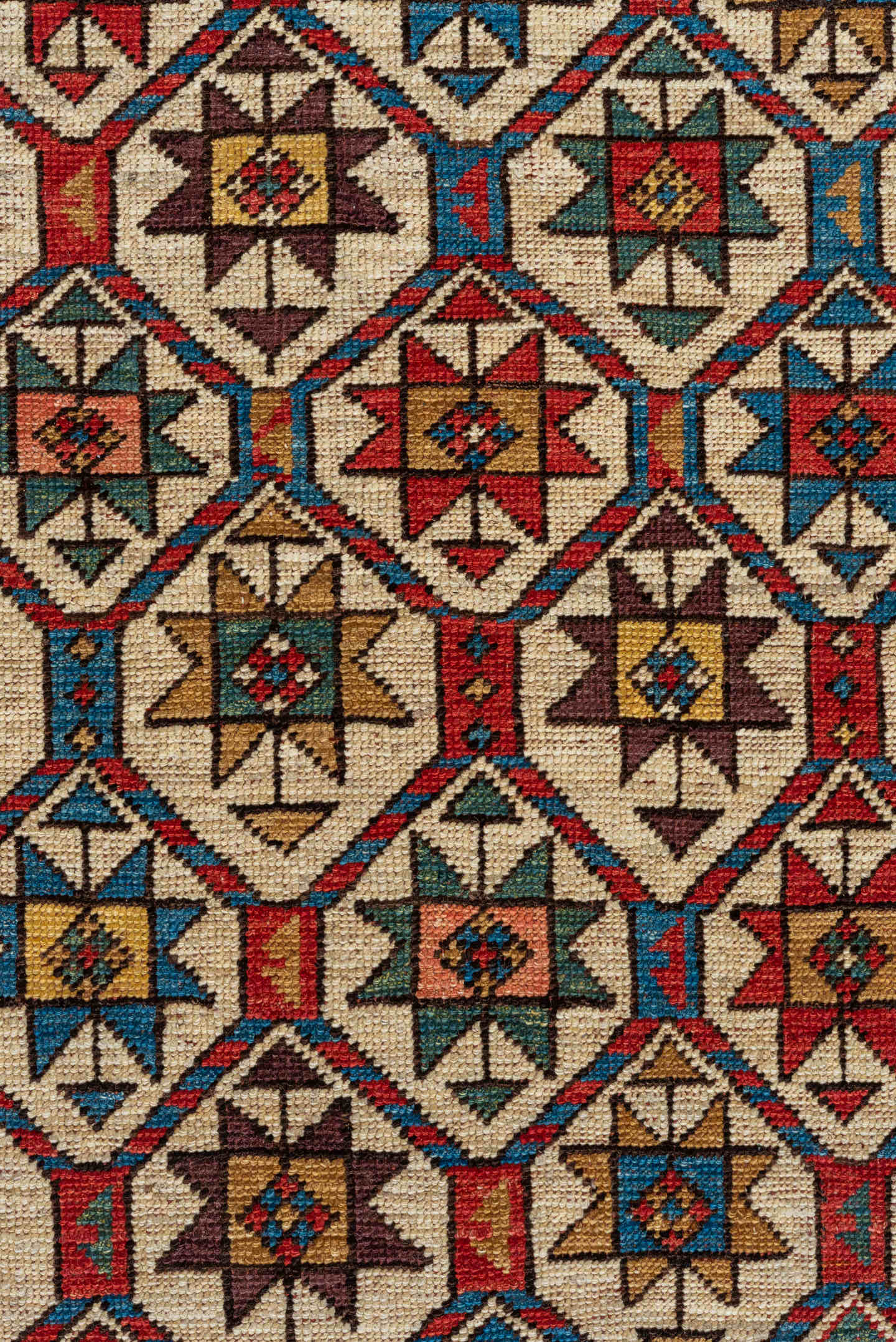 4' x 7' one-of-a-kind handmade vintage Kazak rug. Color palette: red, ivory, sky blue, navy, camel, brown, black, sage