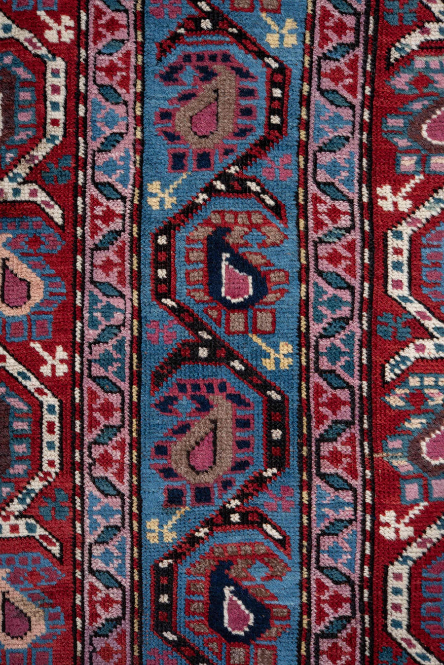 3' x 11' one-of-a-kind handmade antique Caucasian runner rug. Color palette: blue, red, ivory, navy, sky_blue, burgundy