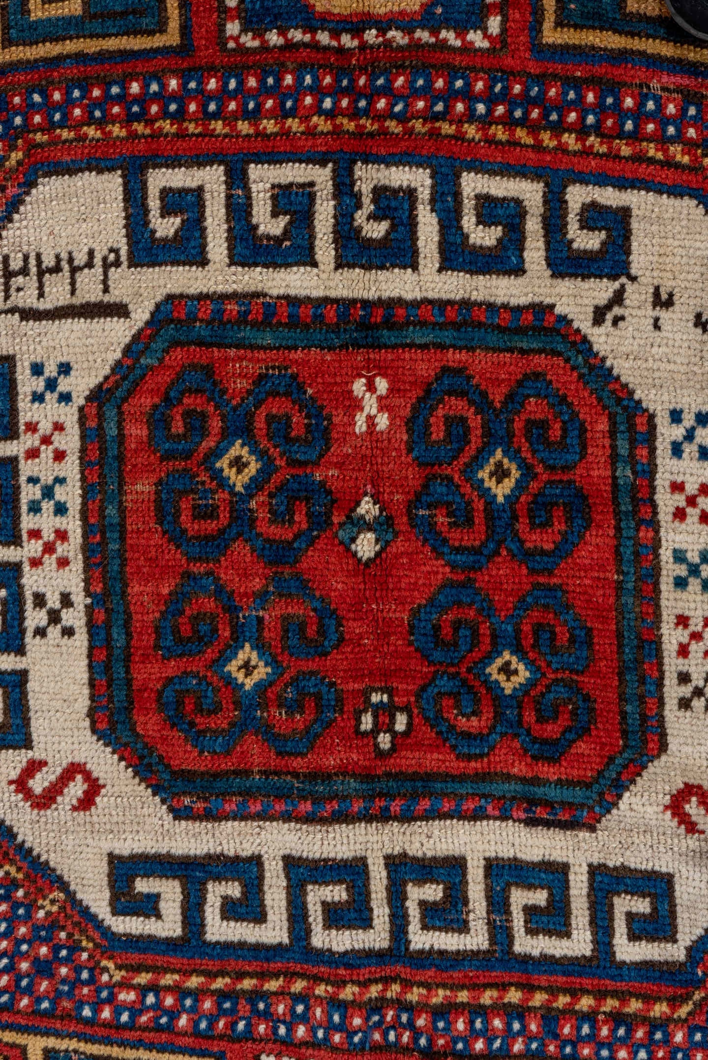 5' x 7' one-of-a-kind handmade vintage Kazak rug. Color palette: red, ivory, blue, navy, brown, rust, gold, terracotta