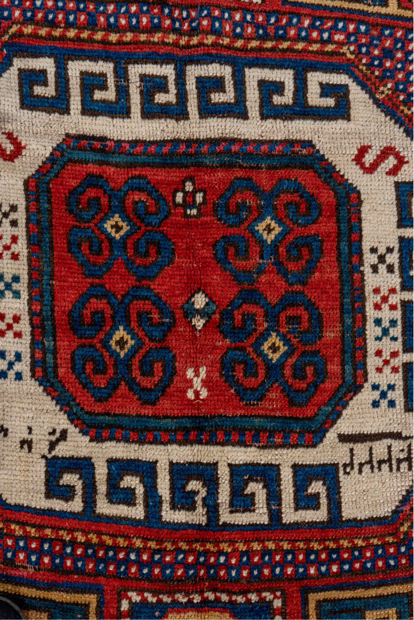 5' x 7' one-of-a-kind handmade vintage Kazak rug. Color palette: red, ivory, blue, navy, brown, rust, gold, terracotta