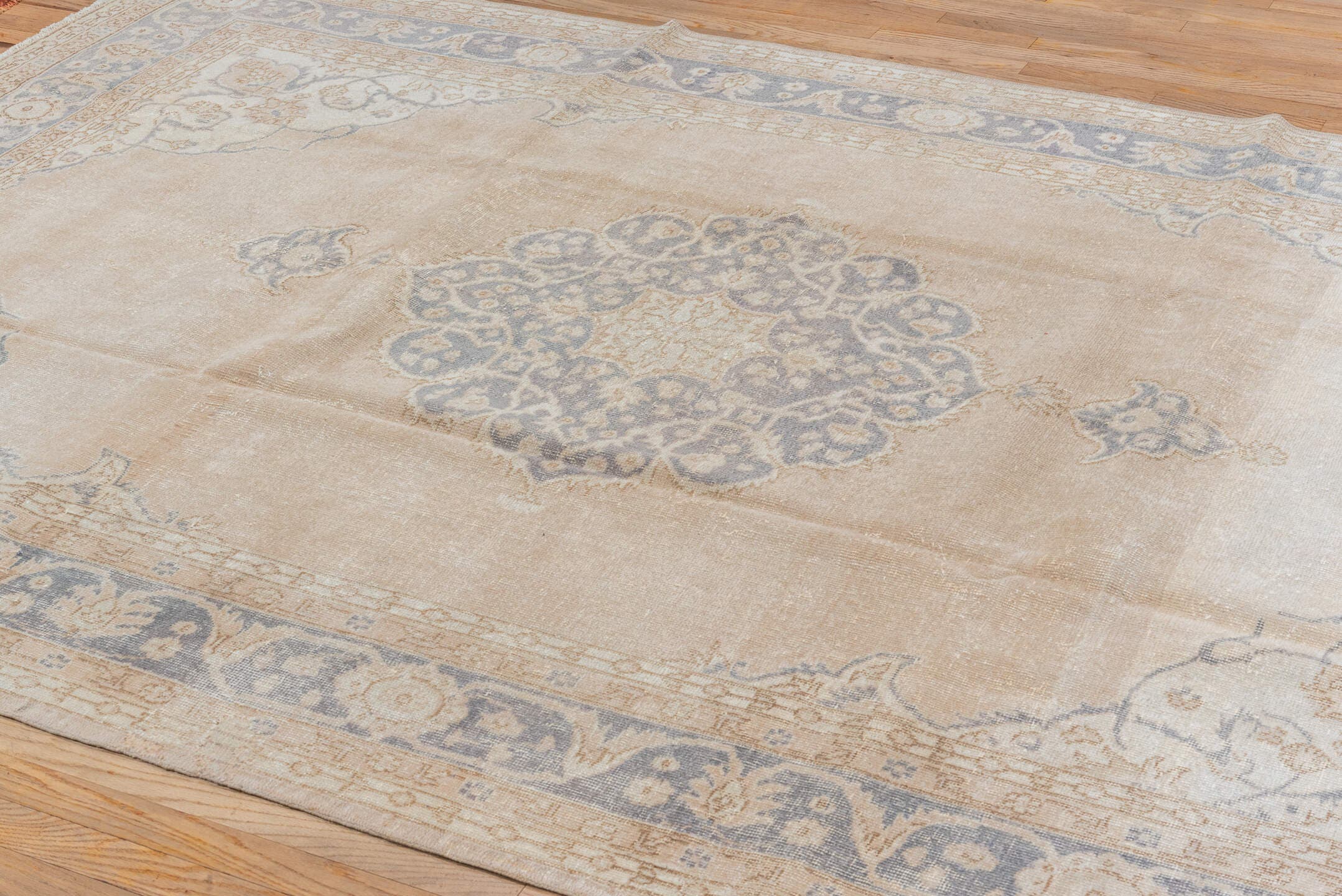 6' x 10' one-of-a-kind handmade vintage Oushak large size rug. Color palette: ivory, beige, faded blue, tan, taupe, blue