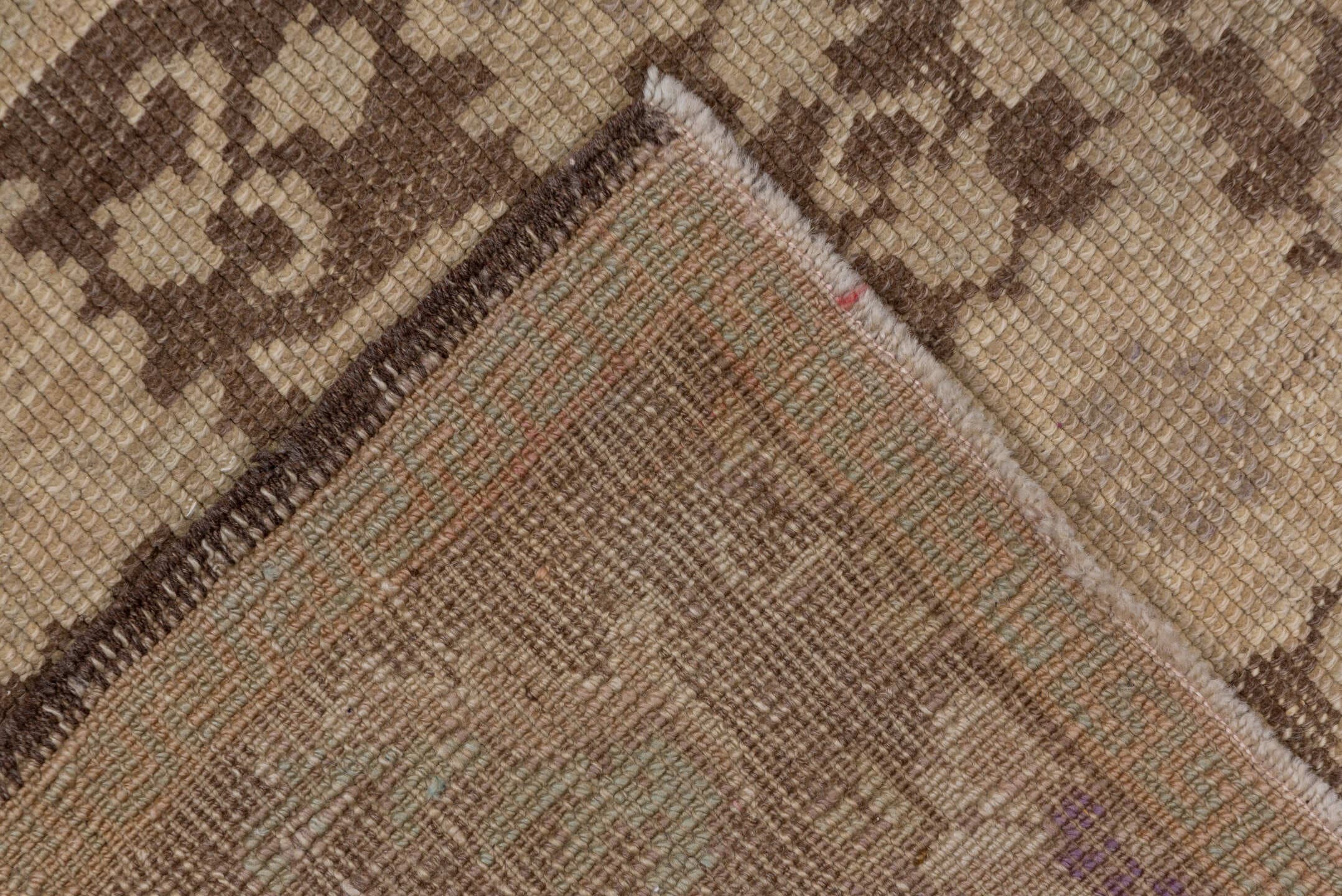 4' x 10' one-of-a-kind handmade vintage Oushak runner rug. Color palette: taupe, brown, beige, camel, ivory, gray