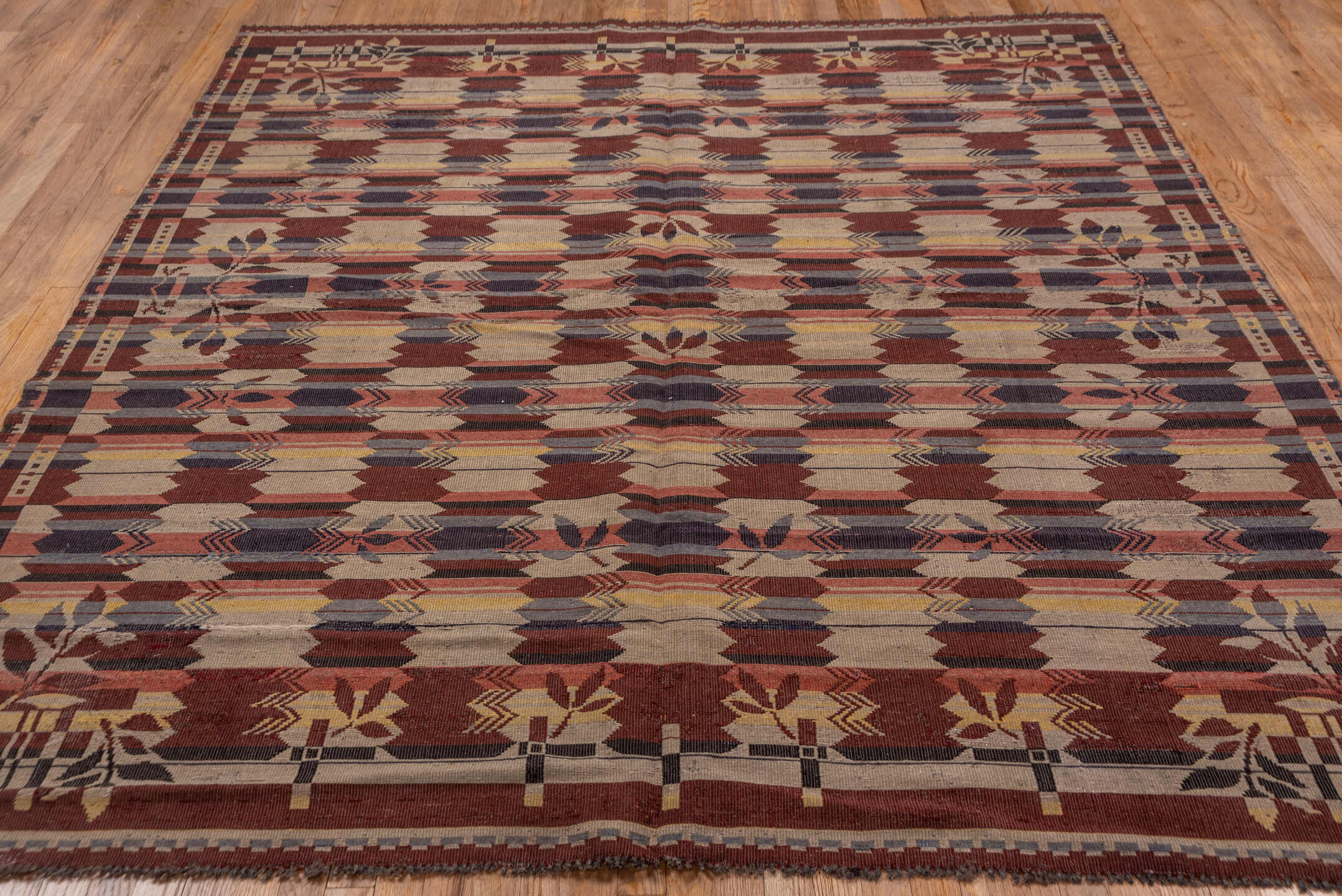 7' x 8' one-of-a-kind handmade vintage Kilim rug. Color palette: black, brown, charcoal, gray, light gray, off-white, pink