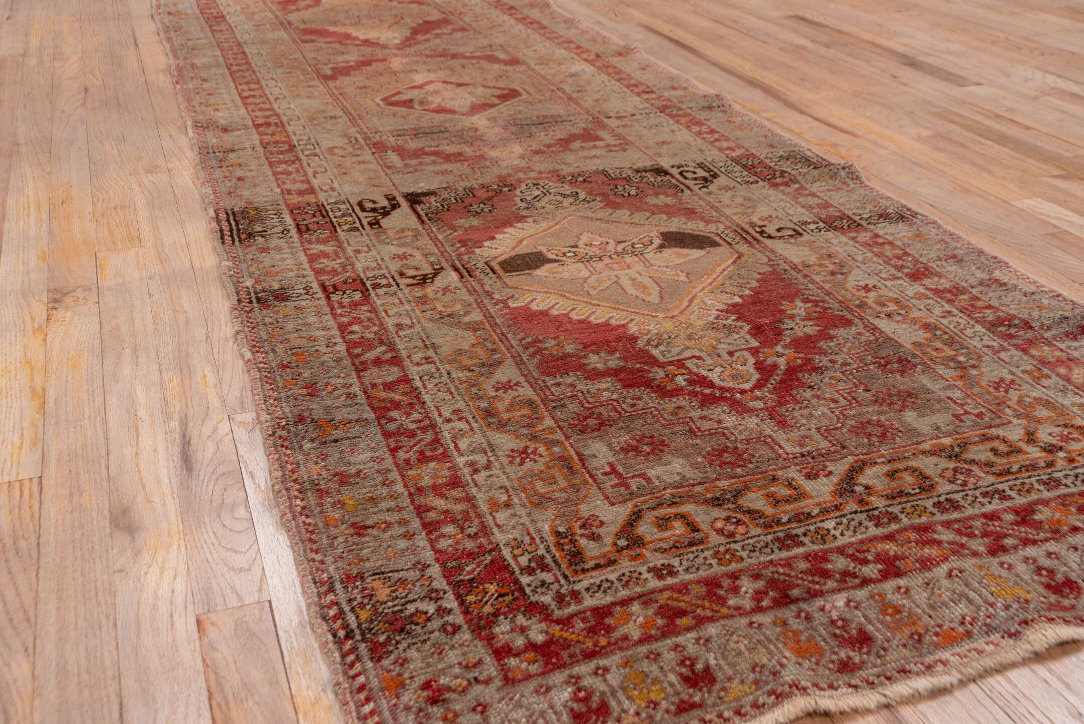3' x 10' one-of-a-kind handmade vintage Sivas runner rug. Color palette: brown, gray, off-white, pink, red, snow, white