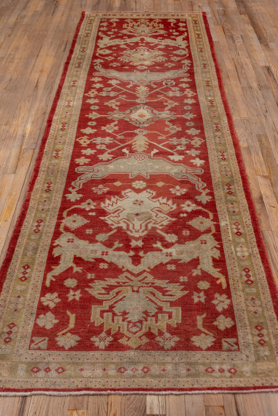 3' x 11' one-of-a-kind handmade vintage Oushak runner rug. Color palette: brown, dark red, maroon, off-white, orange, pink
