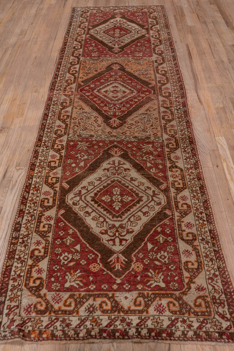 3' x 11' one-of-a-kind handmade vintage Sivas runner rug. Color palette: rust, ivory, terra cotta, brown, burgundy, camel
