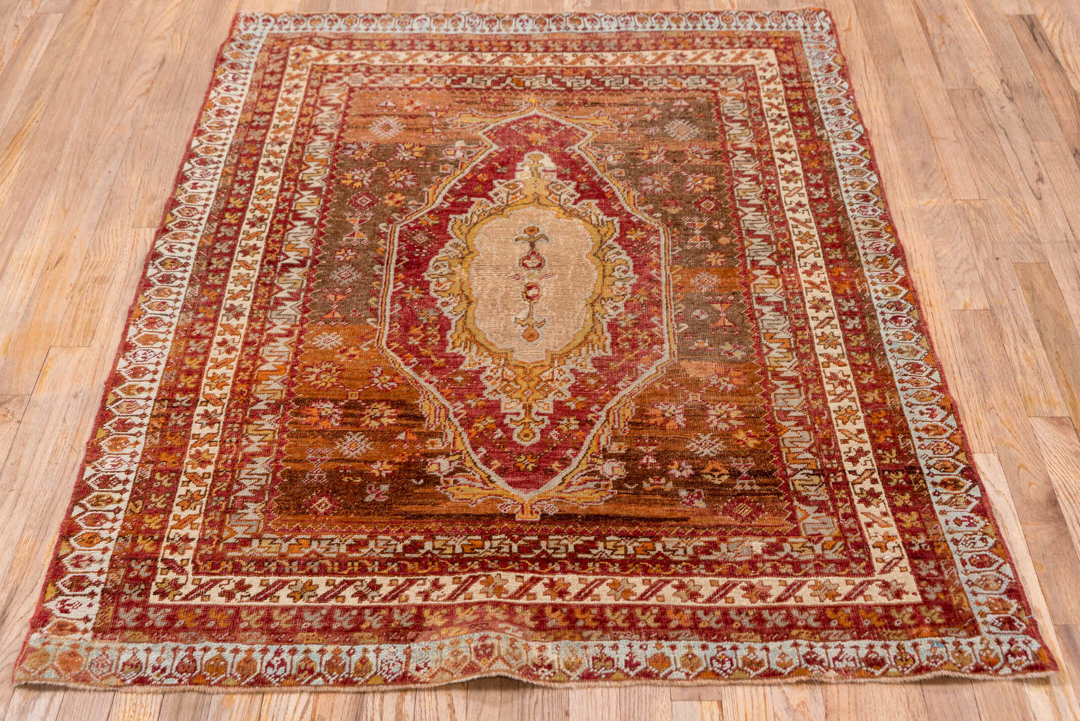 3' x 5' one-of-a-kind handmade vintage Sivas small size rug. Color palette: brown, gray, light gray, off-white, orange, pink