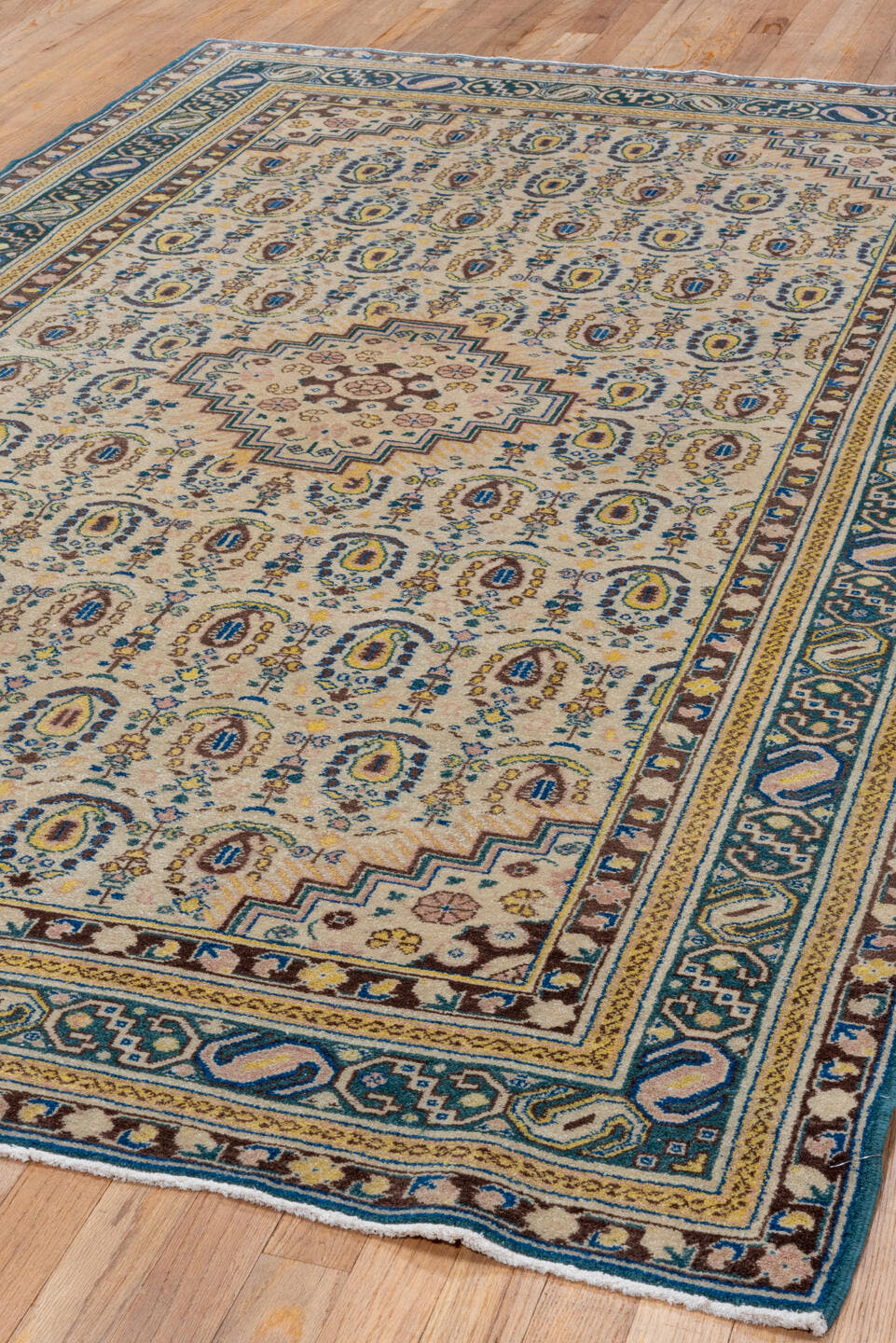 5' x 8' one-of-a-kind handmade vintage Sivas medium size rug. Color palette: ivory, blue, brown, taupe, gold, camel, beige