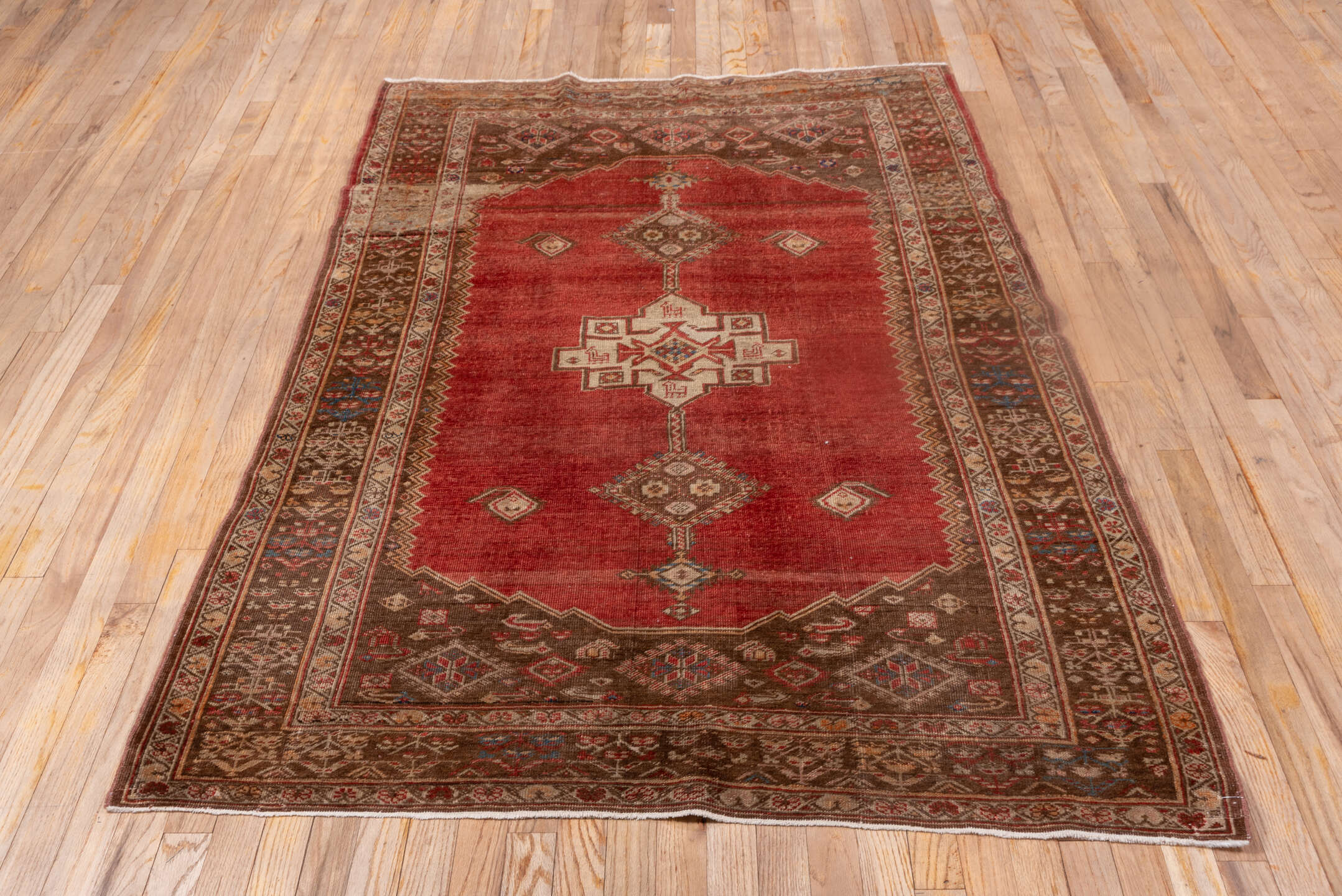 4' x 6' one-of-a-kind handmade vintage Oushak small size rug. Color palette: rust, brown, ivory, terra cotta, camel, blue
