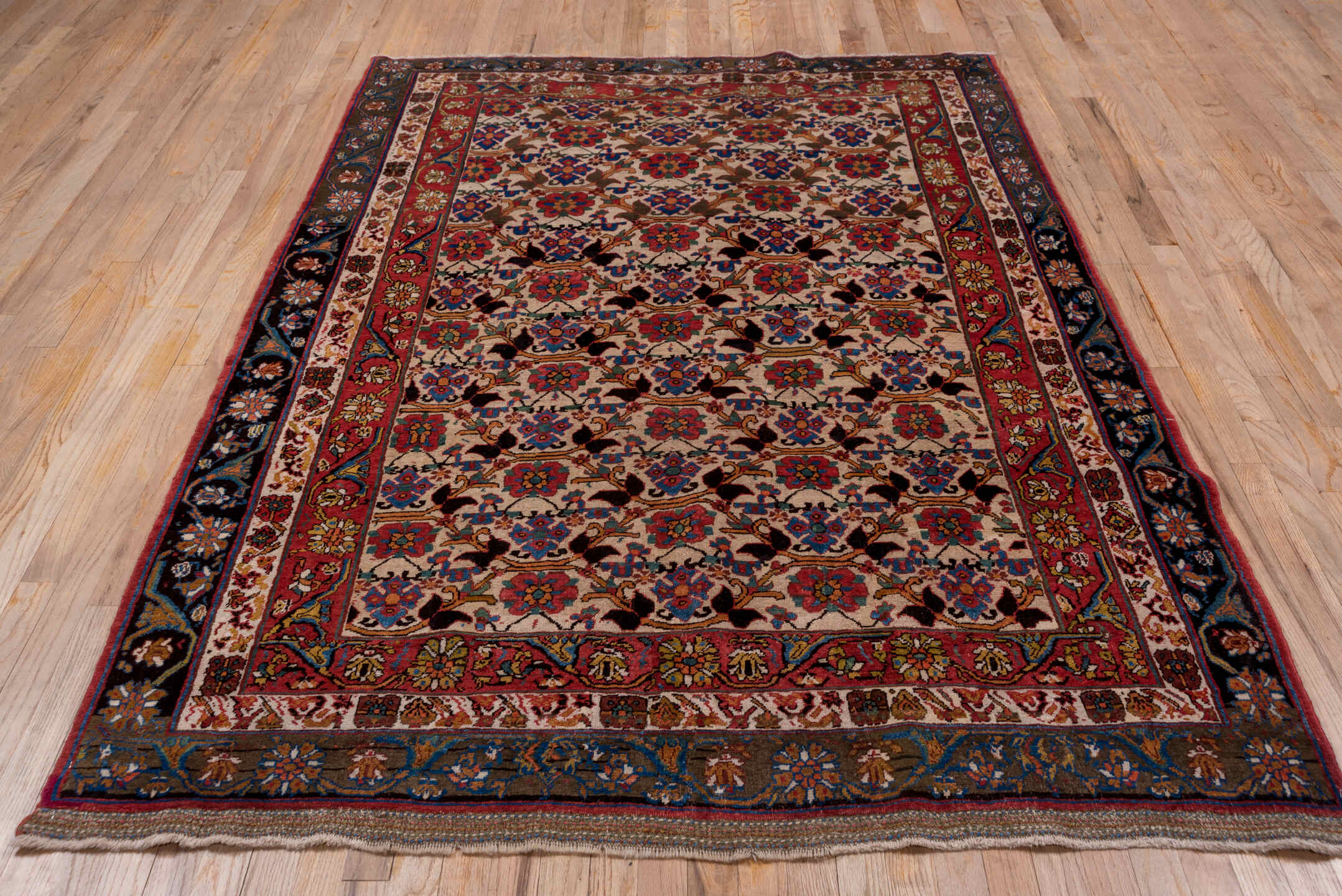 5' x 7' one-of-a-kind handmade vintage Bidjar rug. Color palette: black, blue, brown, fiord, gray, light gray, pink, red
