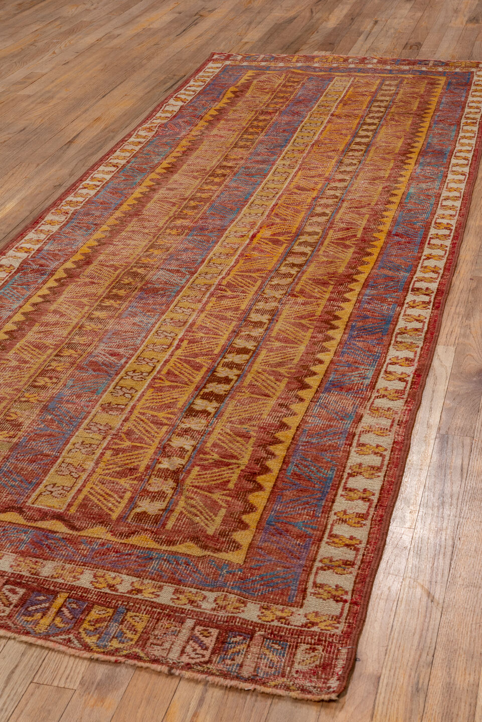 3' x 9' one-of-a-kind handmade vintage Oushak runner rug. Color palette: rust, ivory, blue, gold, terra cotta, camel