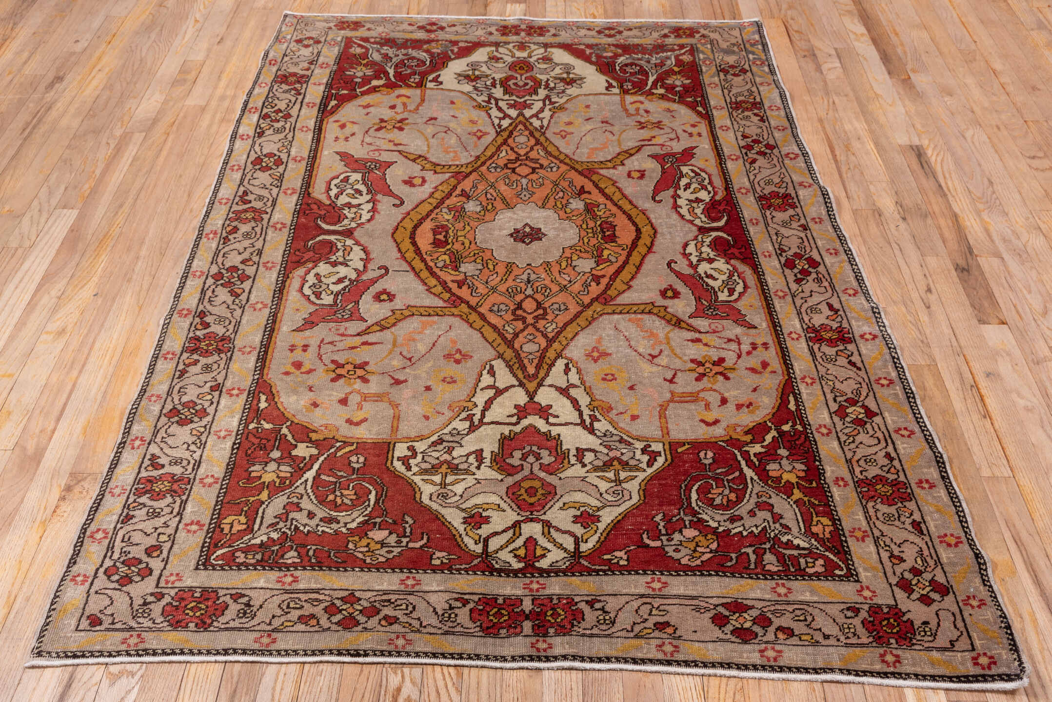 4' x 7' one-of-a-kind handmade vintage Oushak rug. Color palette: ivory, rust, terracotta, crimson, gold, taupe, camel