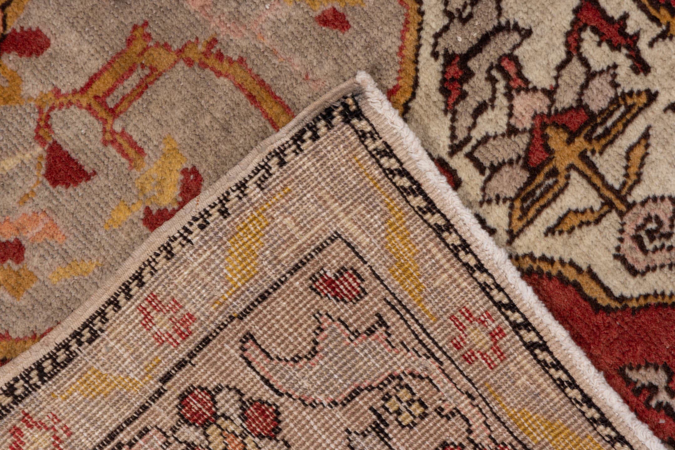 4' x 7' one-of-a-kind handmade vintage Oushak rug. Color palette: ivory, rust, terracotta, crimson, gold, taupe, camel