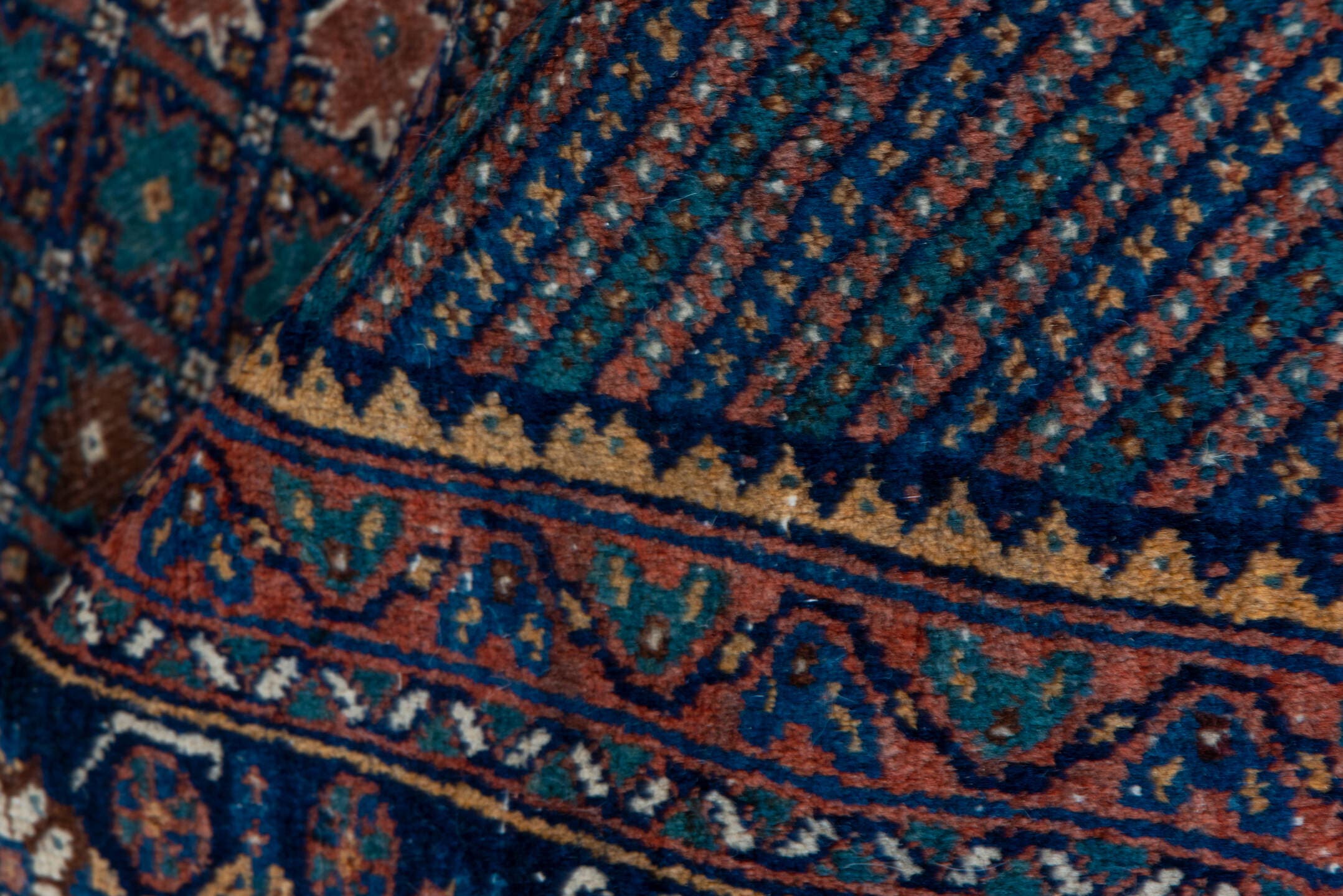 5' x 7' one-of-a-kind handmade antique Afshar rug. Color palette: navy, rust, camel, teal, ivory, rose, brown, blue