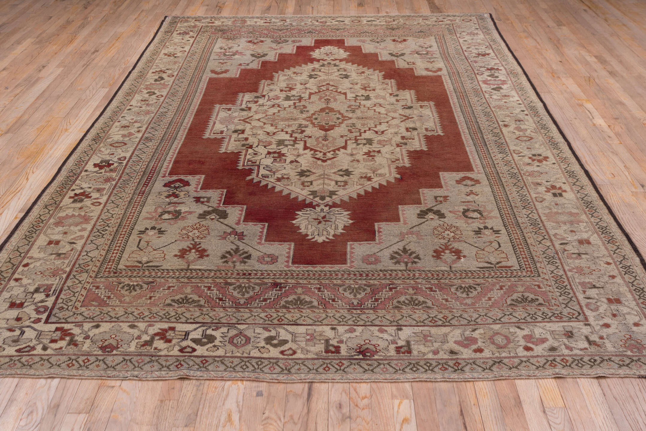 7' x 12' one-of-a-kind handmade vintage Oushak large size rug. Color palette: terra cotta, ivory, rose, taupe, sage