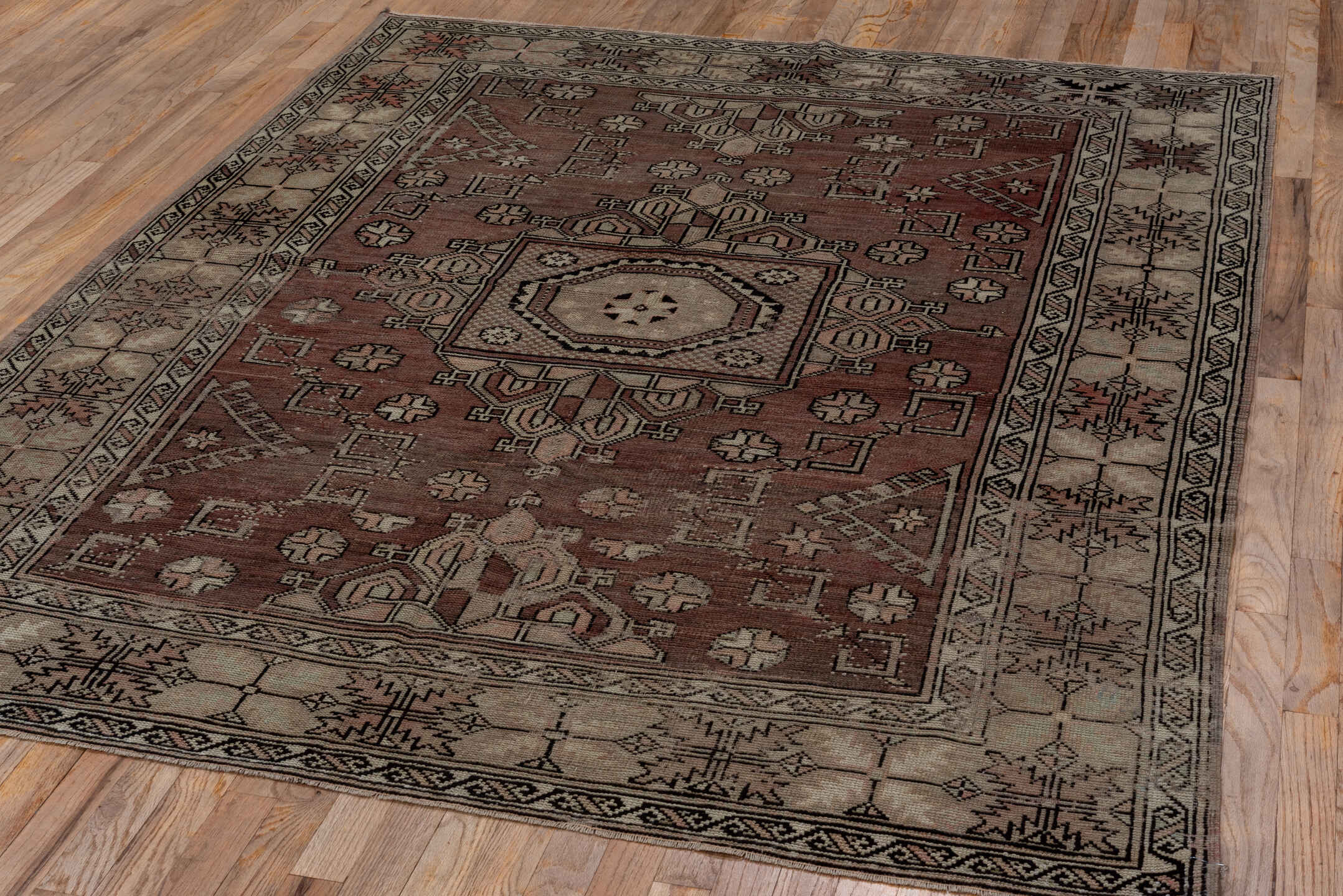 5' x 7' one-of-a-kind handmade vintage Oushak rug. Color palette: black, brown, gray, light gray, pink
