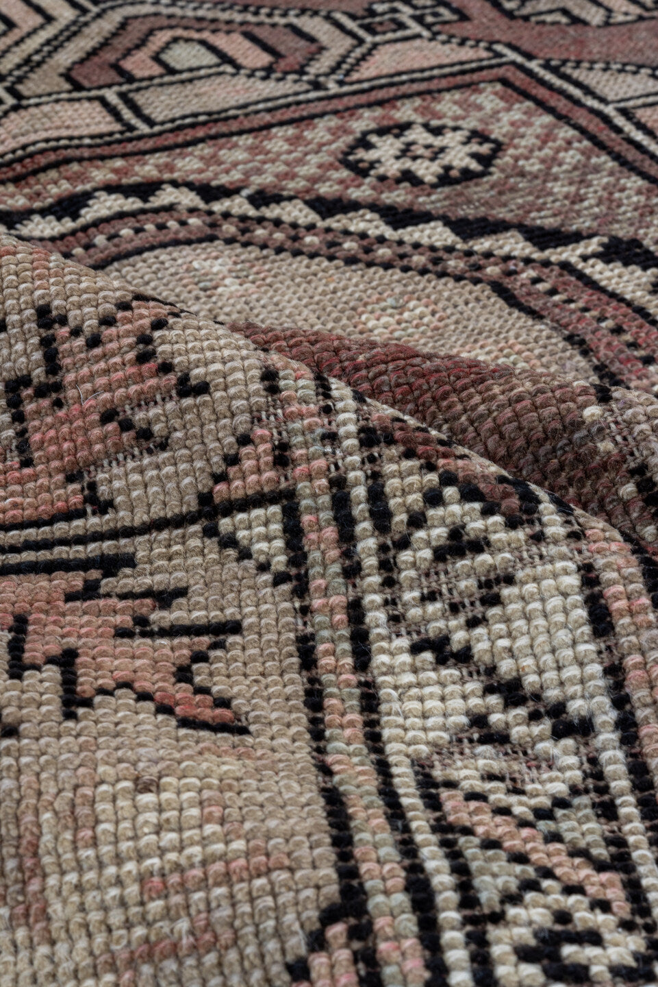 5' x 7' one-of-a-kind handmade vintage Oushak rug. Color palette: black, brown, gray, light gray, pink