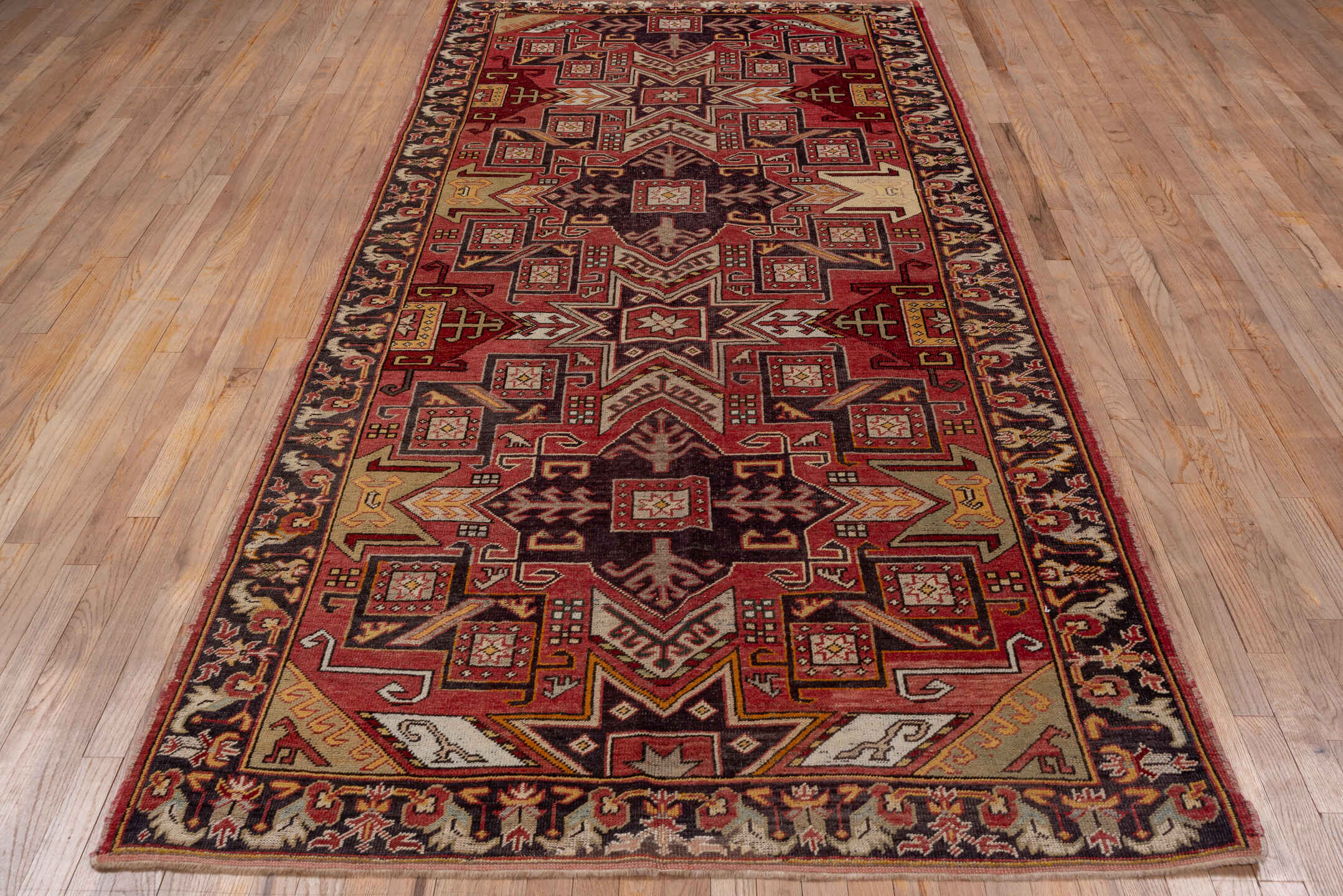 5' x 10' one-of-a-kind handmade vintage Oushak runner rug. Color palette: brown, gray, pink, red, redwood