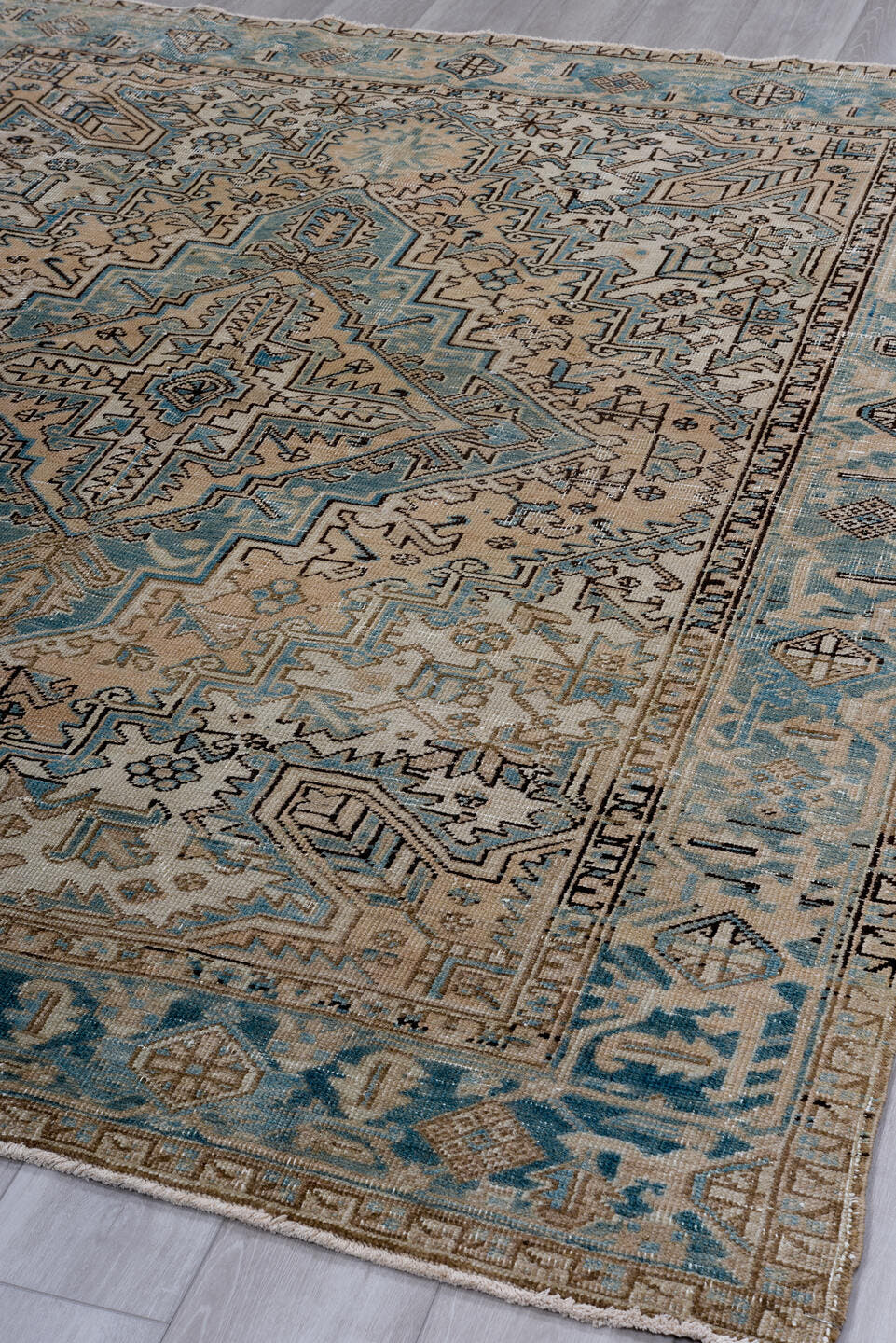 6' x 8' one-of-a-kind handmade antique Heriz medium size rug. Color palette: ivory, sky blue, taupe, brown, camel, charcoal