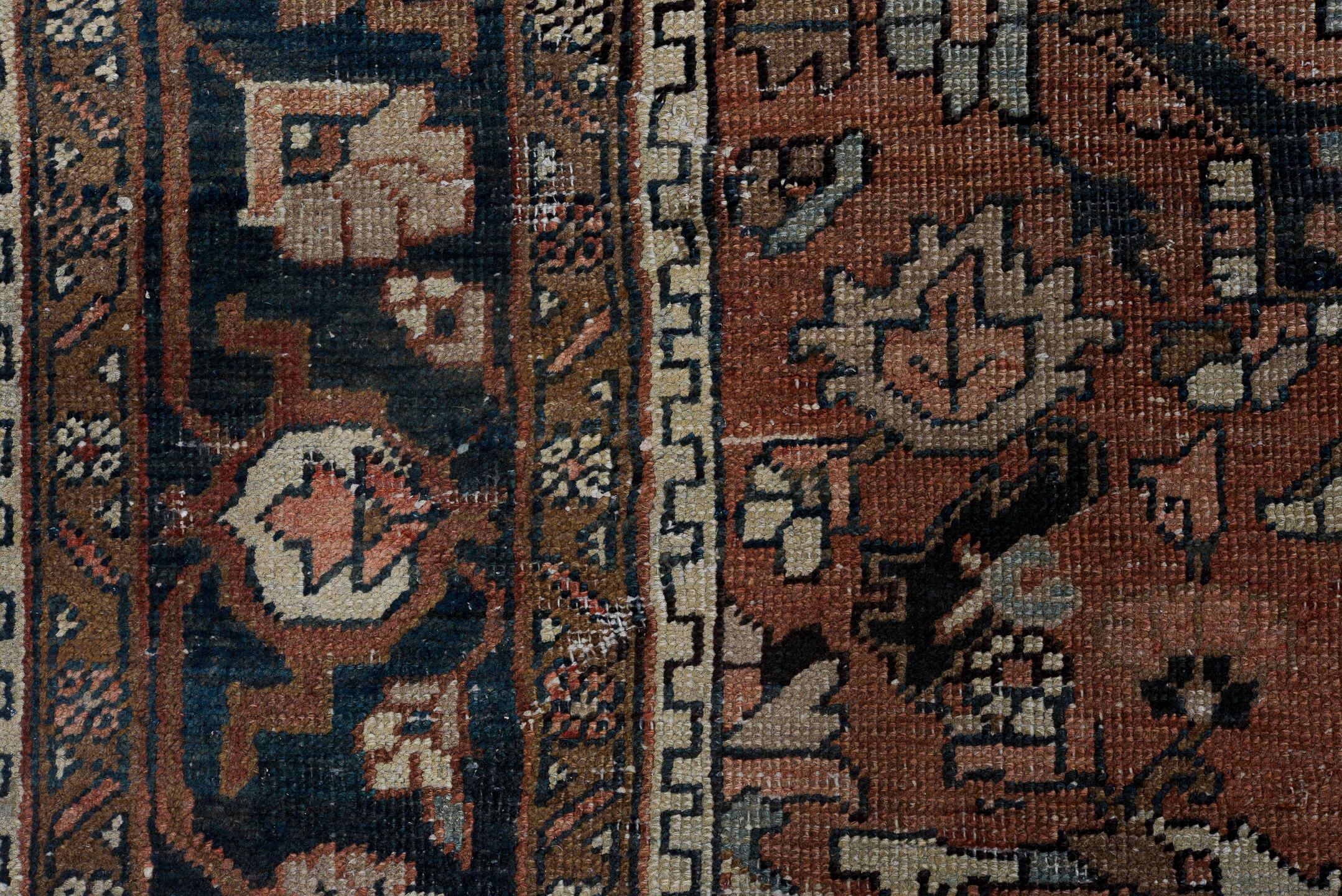 6' x 9' one-of-a-kind handmade antique Heriz medium size rug. Color palette: terra cotta, navy, ivory, slate, taupe, rust