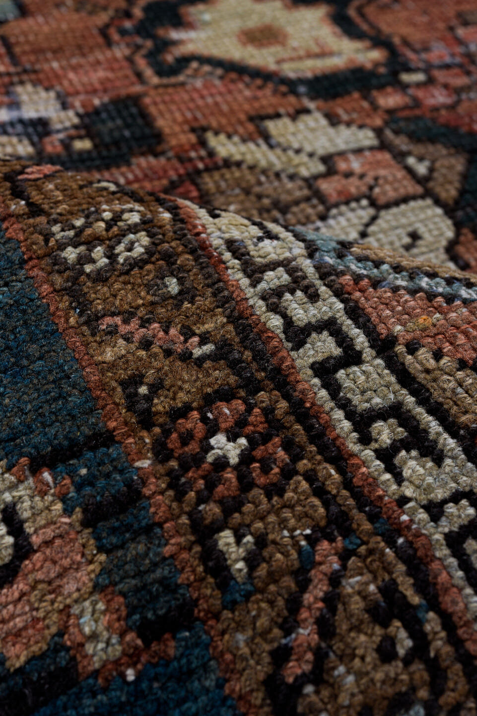 6' x 9' one-of-a-kind handmade antique Heriz medium size rug. Color palette: terra cotta, navy, ivory, slate, taupe, rust