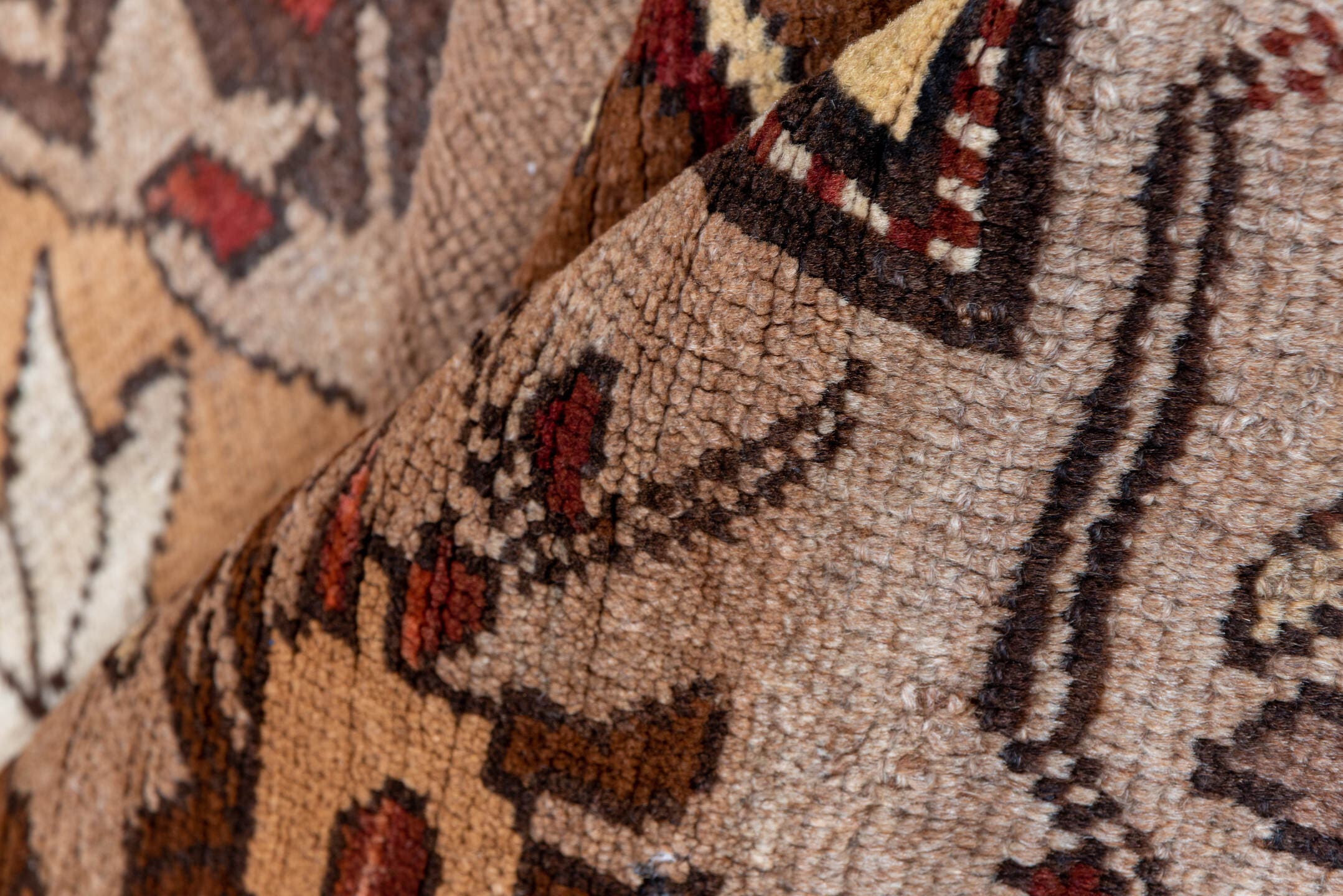 7' x 9' one-of-a-kind handmade vintage Kars rug. Color palette: taupe, brown, ivory, walnut, rust, charcoal, camel, burgundy