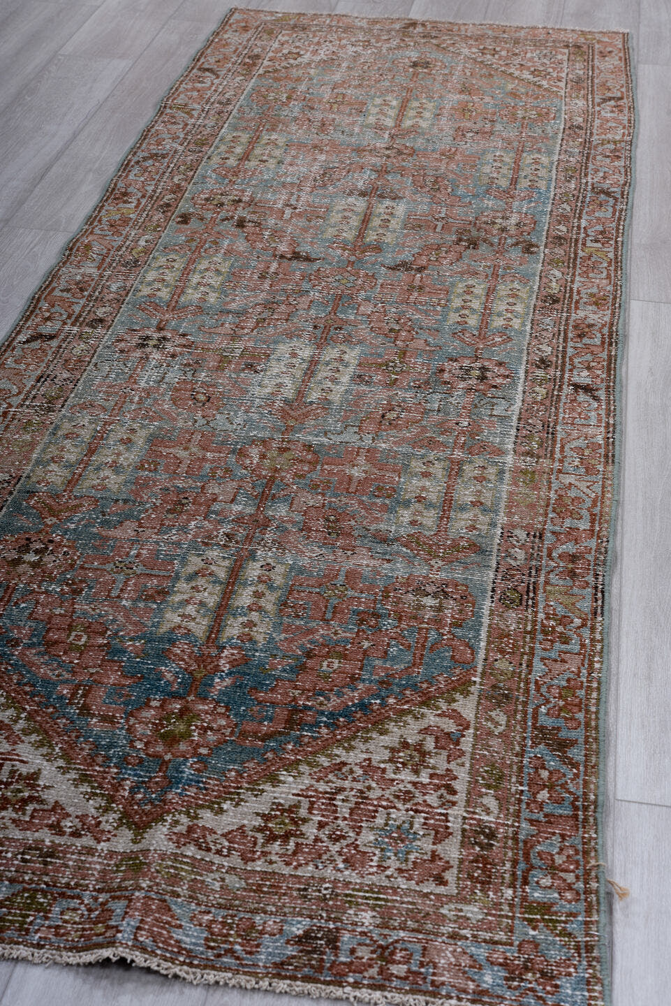 3' x 9' one-of-a-kind handmade vintage Malayer runner rug. Color palette: terra cotta, pale blue, ivory, rust, charcoal