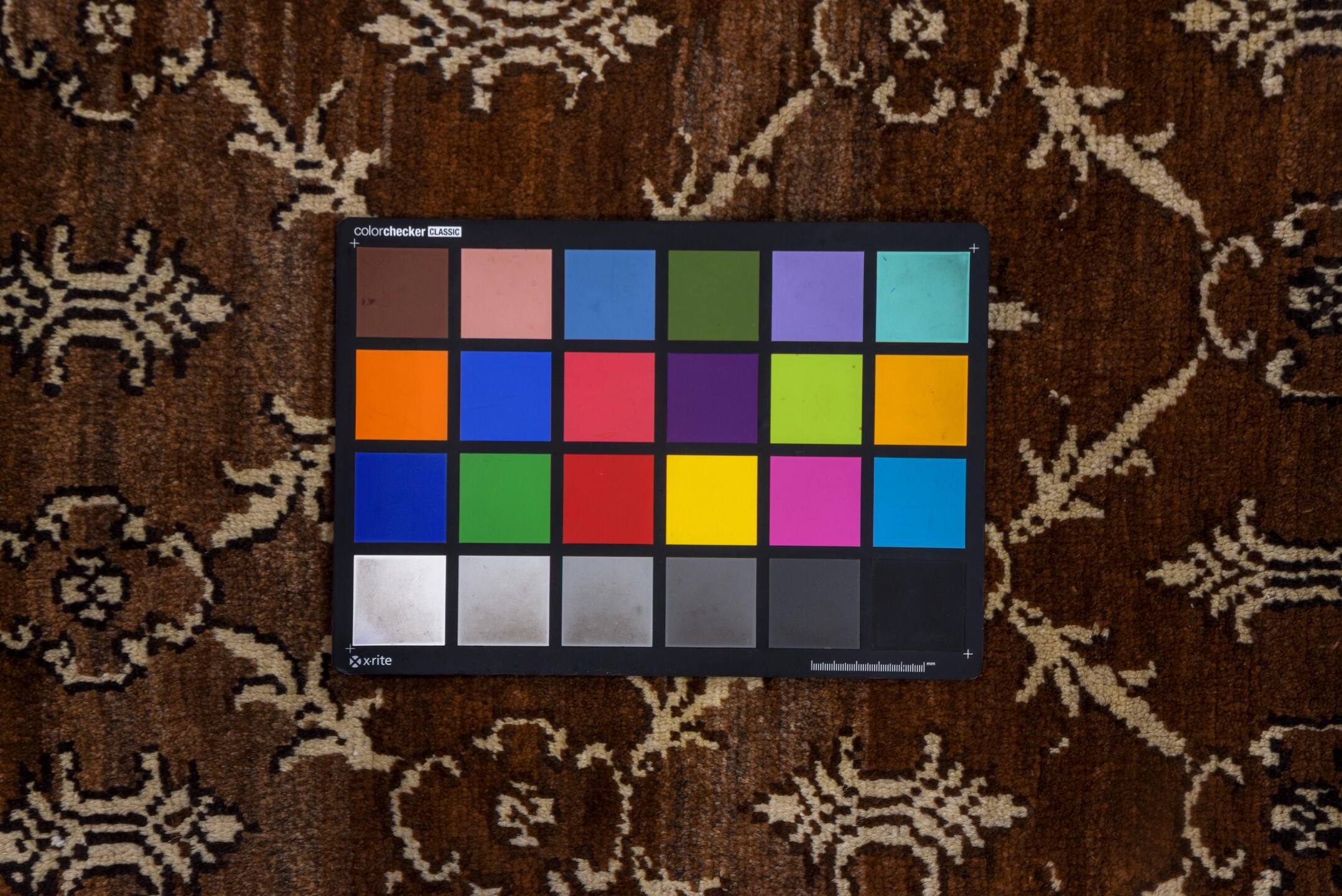 7' x 9' one-of-a-kind handmade vintage Kars rug. Color palette: brown, gray, light gray, off-white, pink