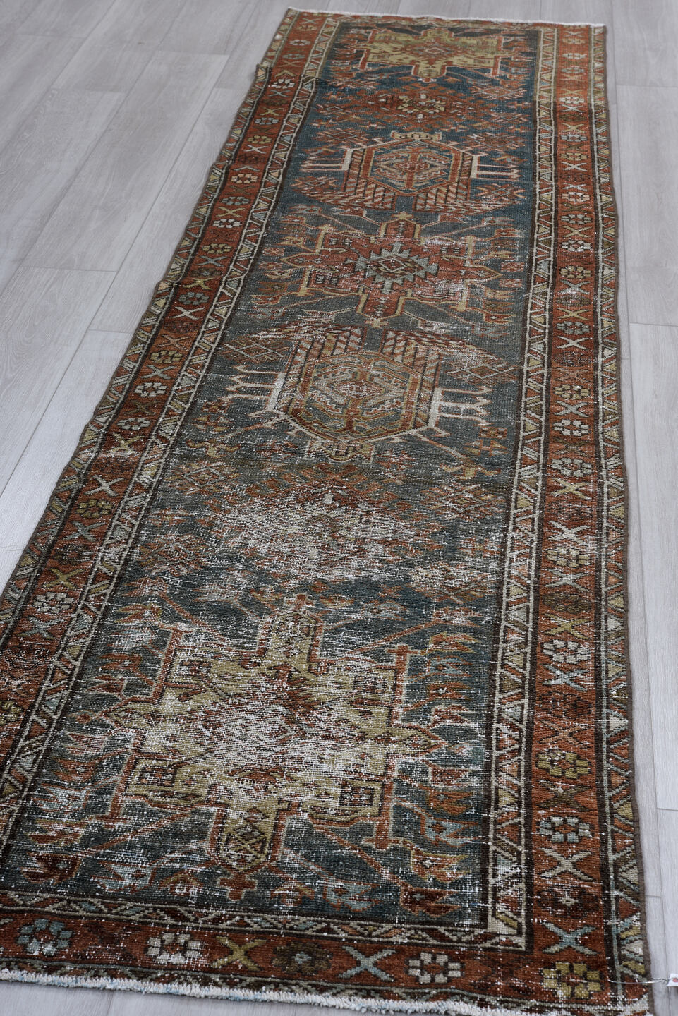 2' x 10' one-of-a-kind handmade vintage Karaje runner rug. Color palette: black, blue, brown, charcoal, gray, light gray