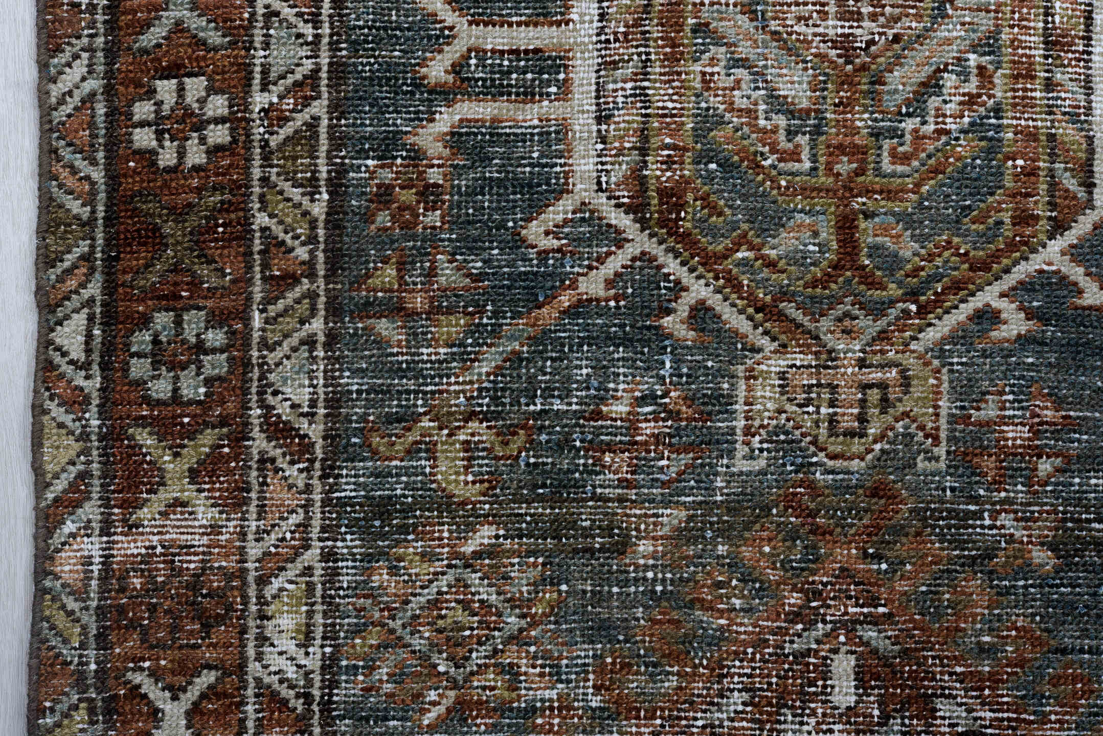 2' x 10' one-of-a-kind handmade vintage Karaje runner rug. Color palette: black, blue, brown, charcoal, gray, light gray