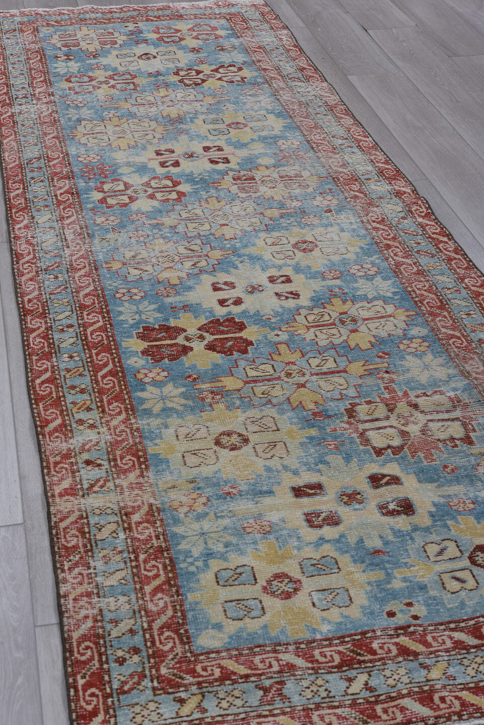 3' x 10' one-of-a-kind handmade antique Heriz runner rug. Color palette: sky blue, rust, ivory, brick, pale blue, cream