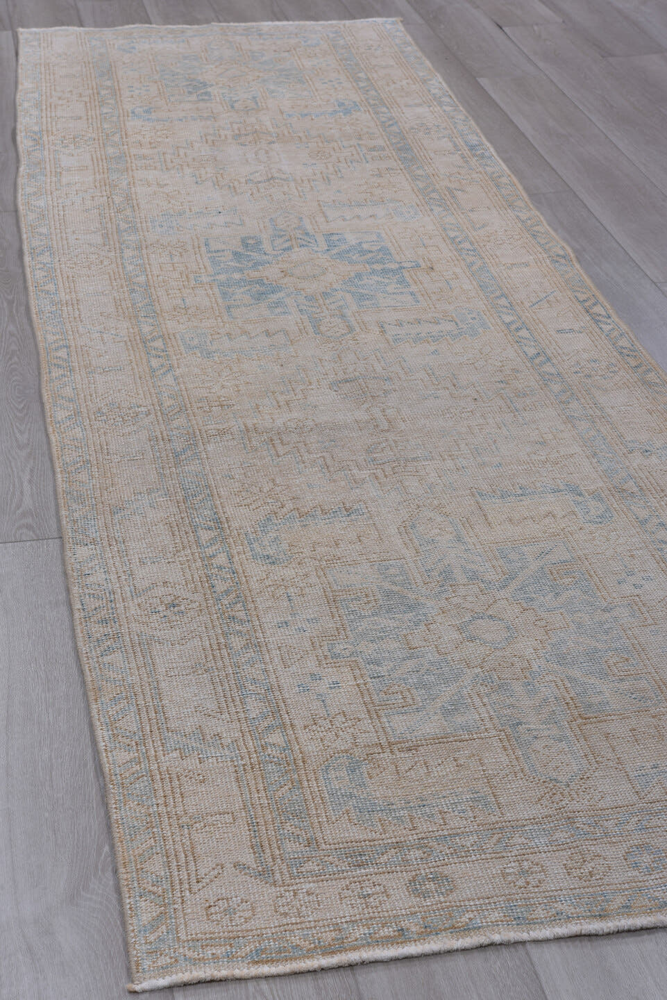 3' x 10' one-of-a-kind handmade antique Sarab runner rug. Color palette: ivory, pale blue, taupe, beige, camel, light blue