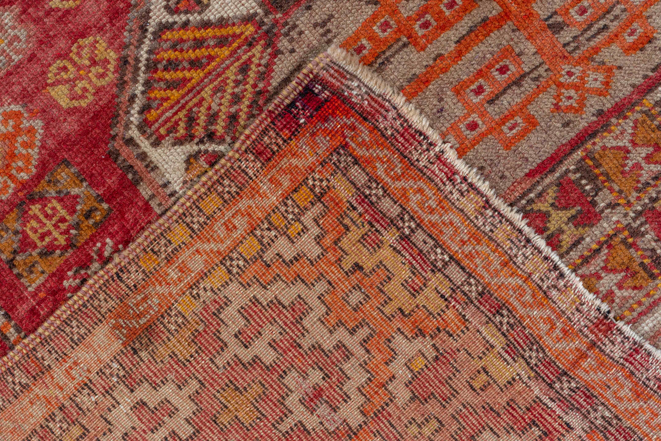 4' x 11' one-of-a-kind handmade vintage Oushak runner rug. Color palette: brown, maroon, pink, red, sienna