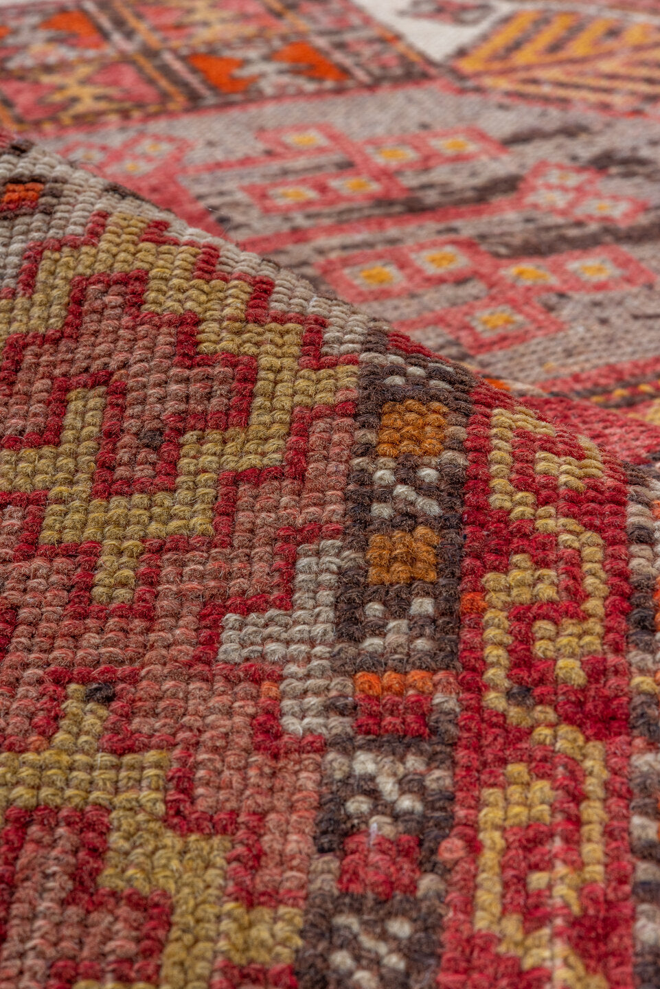 4' x 11' one-of-a-kind handmade vintage Oushak runner rug. Color palette: brown, maroon, pink, red, sienna