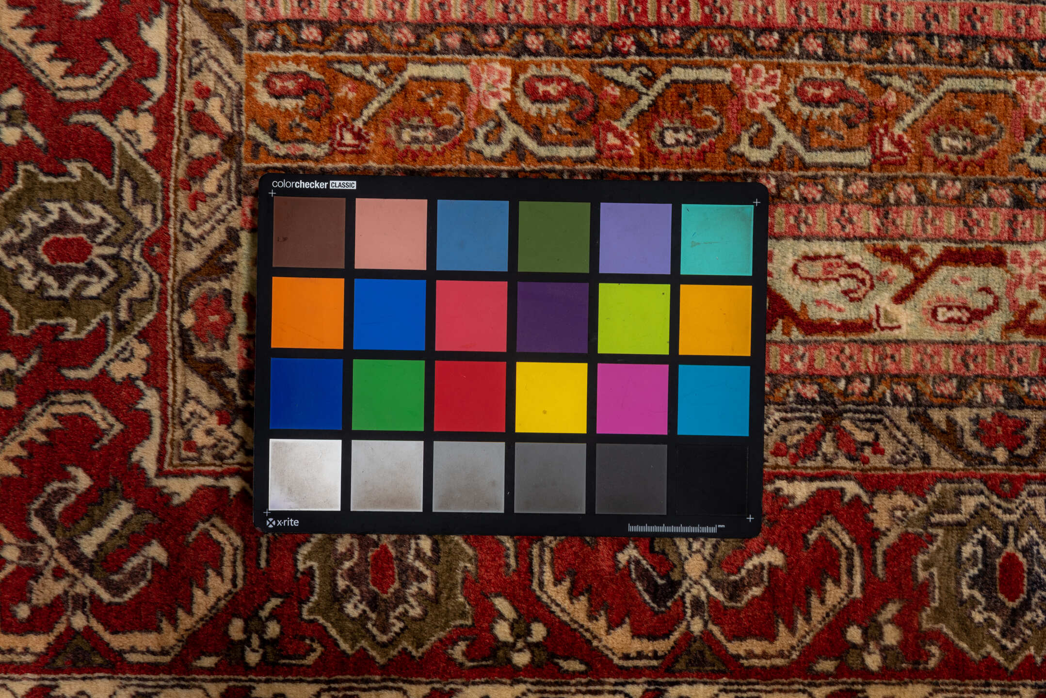 3' x 11' one-of-a-kind handmade vintage Sivas runner rug. Color palette: brown, maroon, orange, pink, red, tan