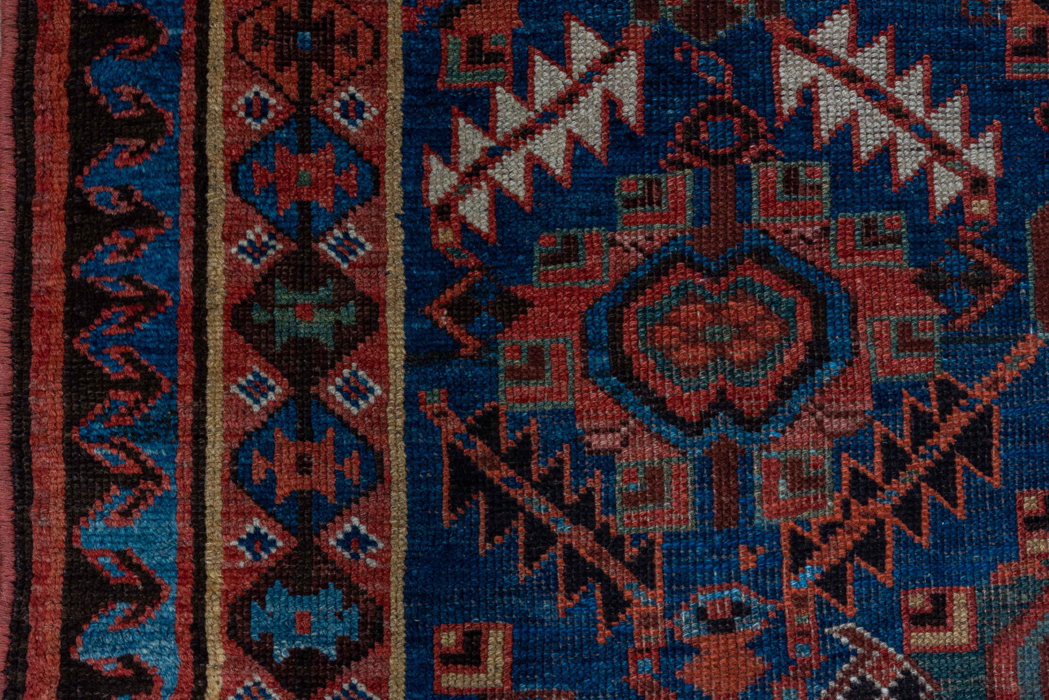 4' x 7' one-of-a-kind handmade antique NW Persian rug. Color palette: indigo, rust, ivory, crimson, slate, camel, charcoal