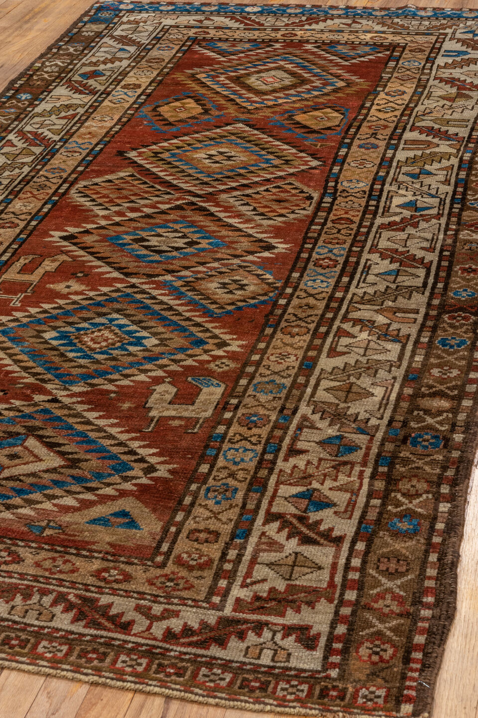 4' x 9' one-of-a-kind handmade vintage Kurd runner rug. Color palette: arapawa, blue, brown, gray, light gray, pink